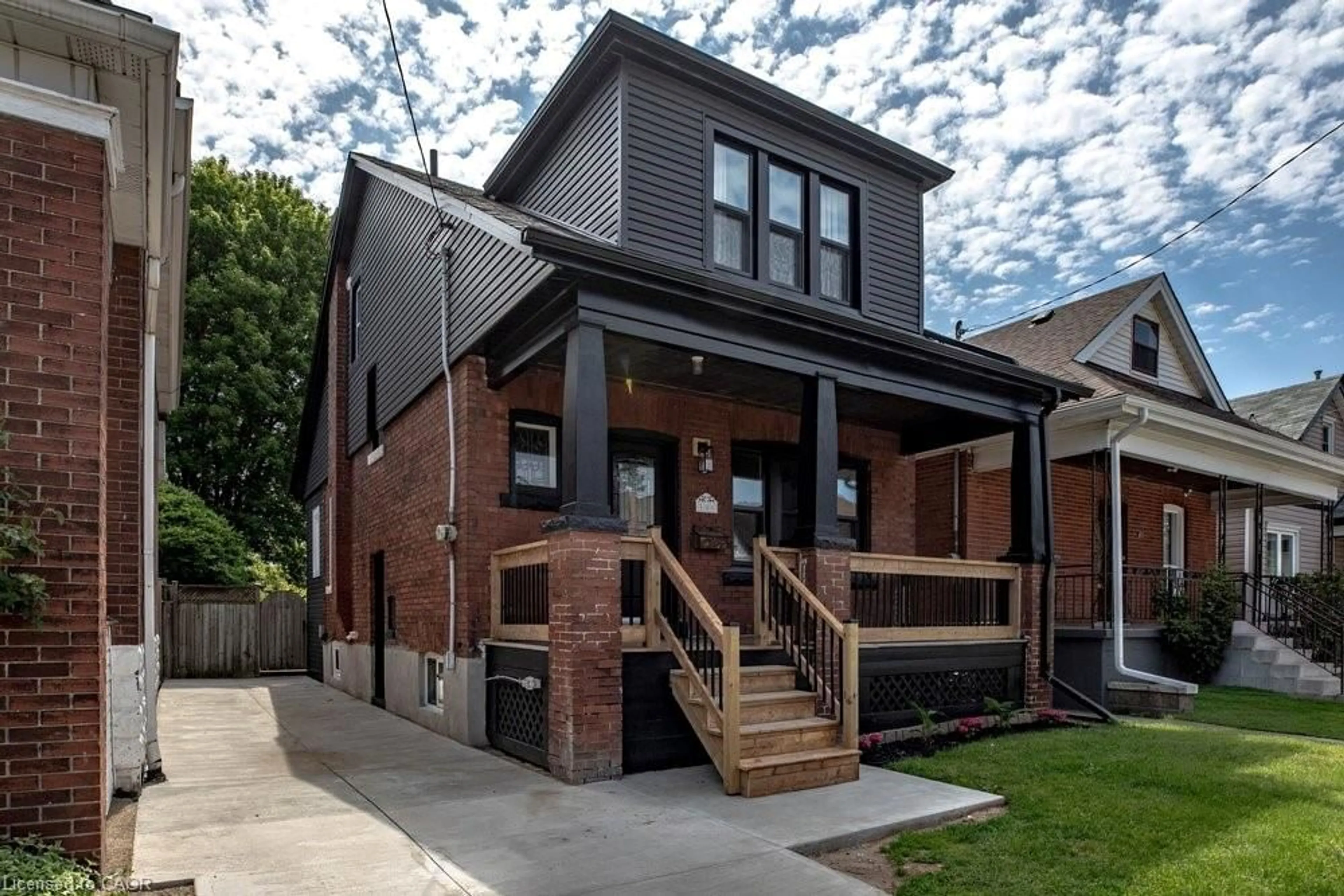 Home with brick exterior material, street for 106 Grosvenor Ave, Hamilton Ontario L8L 7S6