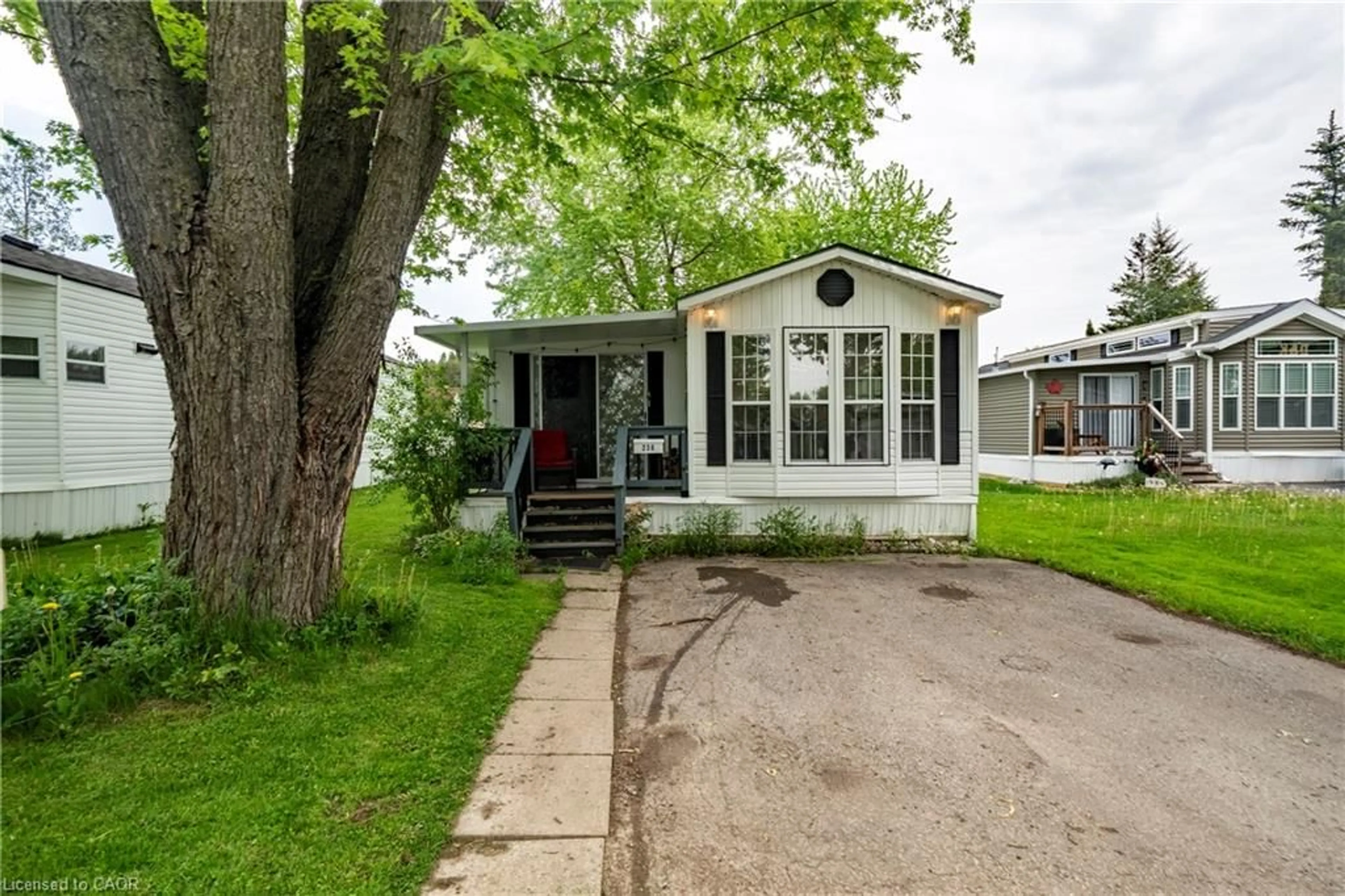 Home with vinyl exterior material, street for 580 Beaver Creek Rd #236, Waterloo Ontario N2J 3Z4