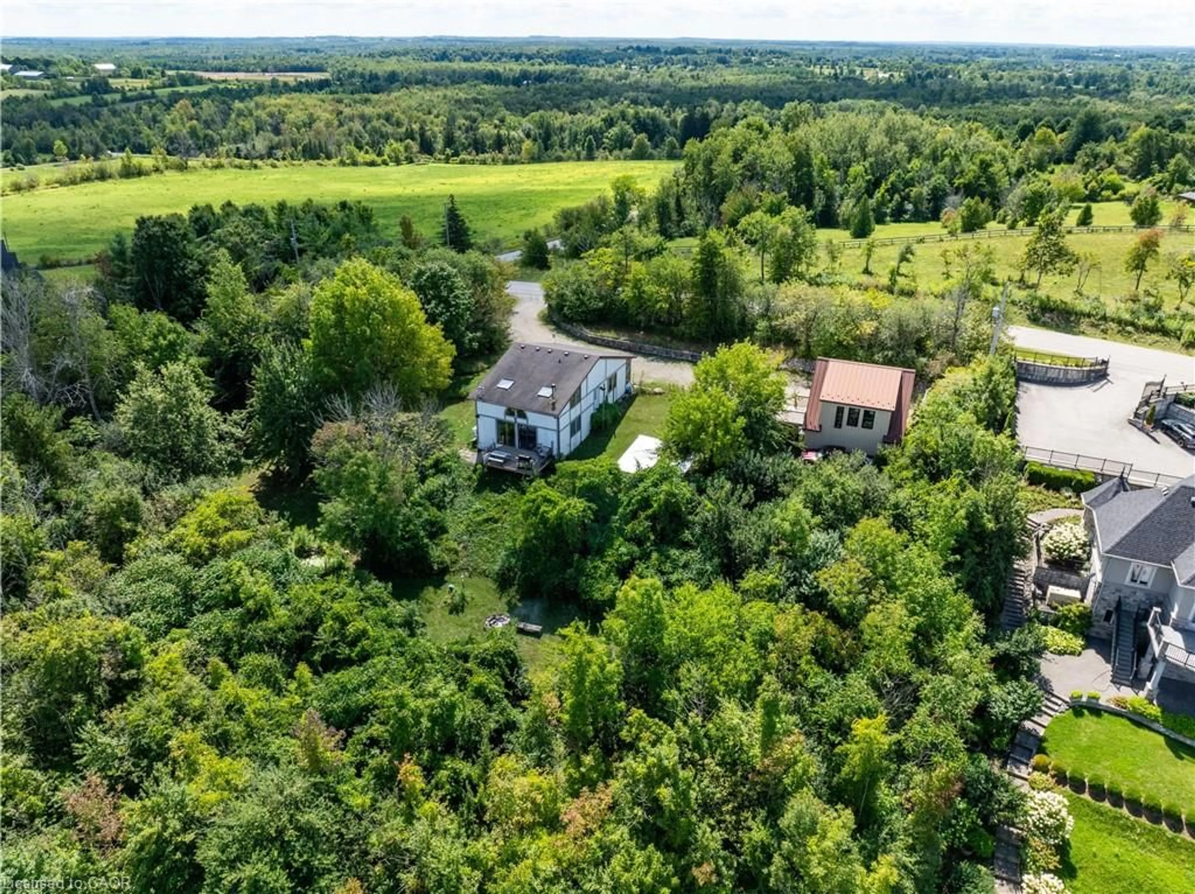 A pic from outside/outdoor area/front of a property/back of a property/a pic from drone, forest/trees view for 4053 Watson Rd, Puslinch Ontario N0B 2J0