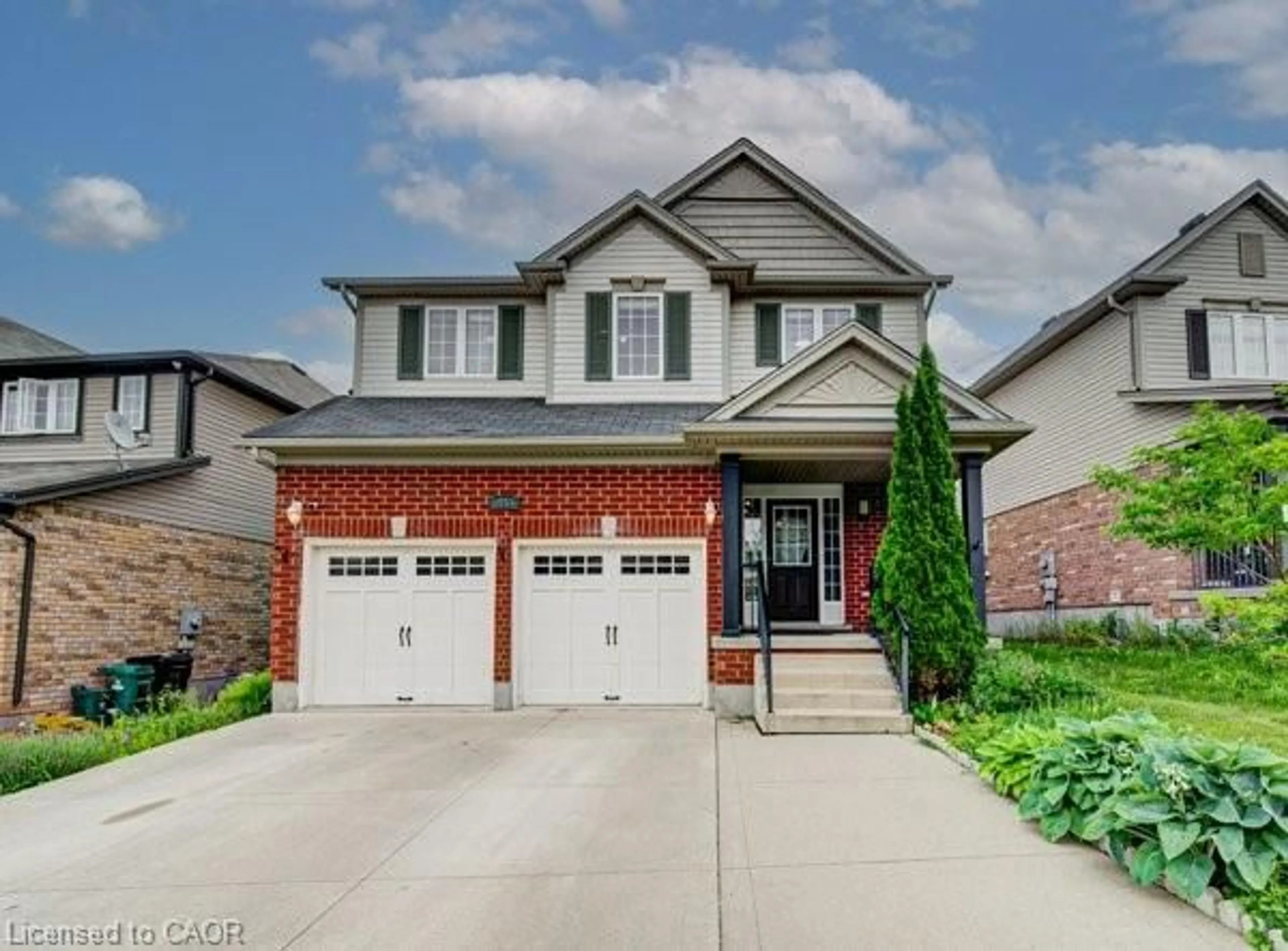 Home with brick exterior material, street for 55 Isaiah Dr, Kitchener Ontario N2E 0B2