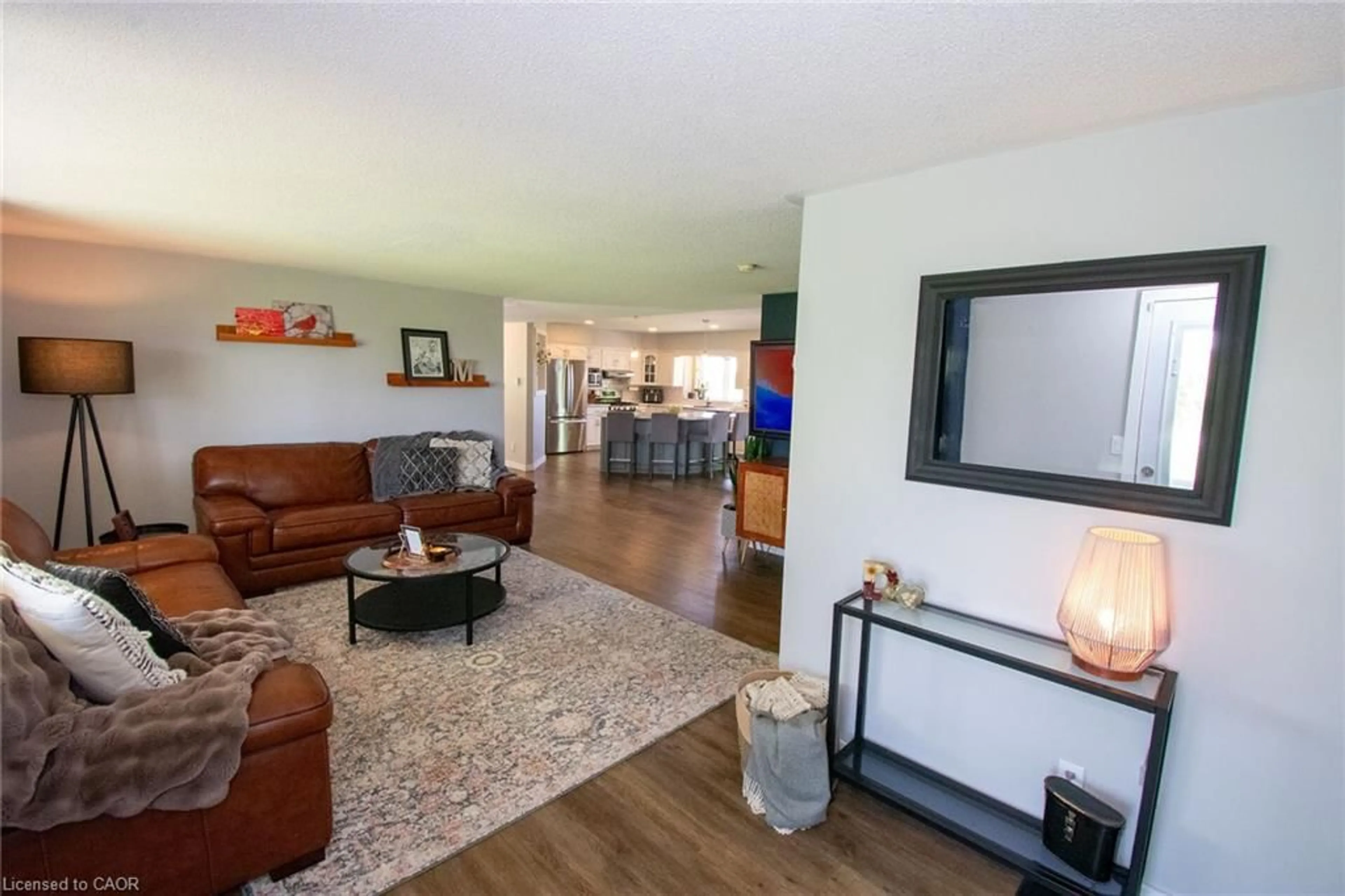 Living room with furniture, wood/laminate floor for 44 Pyle Rd, Lowbanks Ontario N0A 1K0