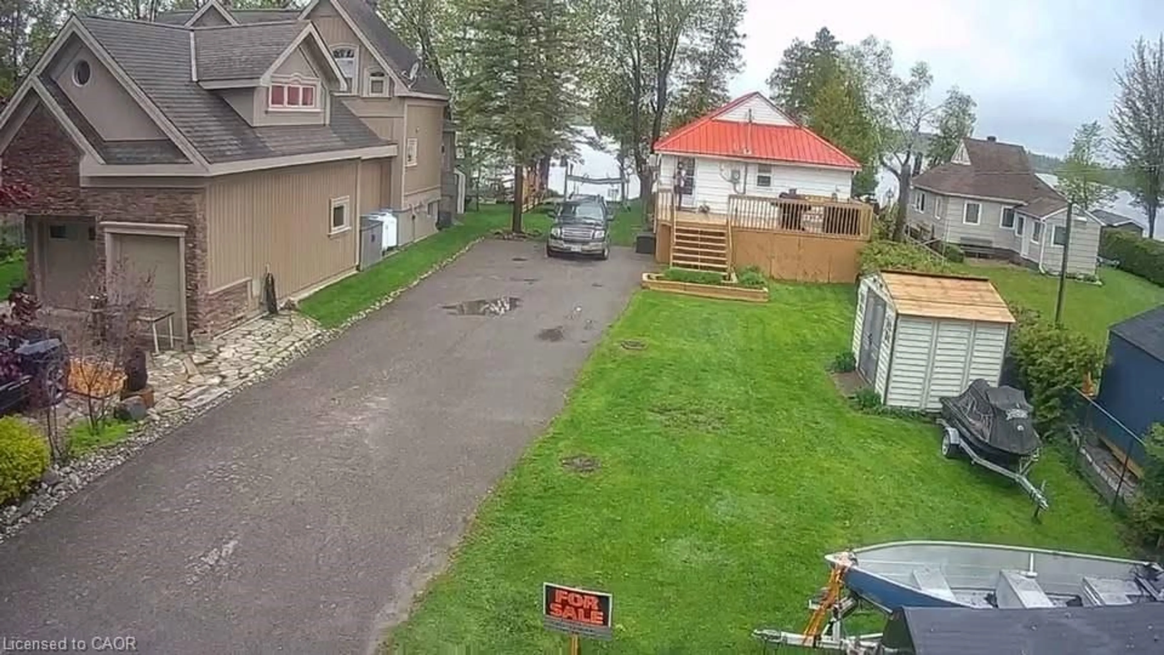 A pic from outside/outdoor area/front of a property/back of a property/a pic from drone, street for 4250 Plum Point Rd, Ramara Ontario L3V 0P8
