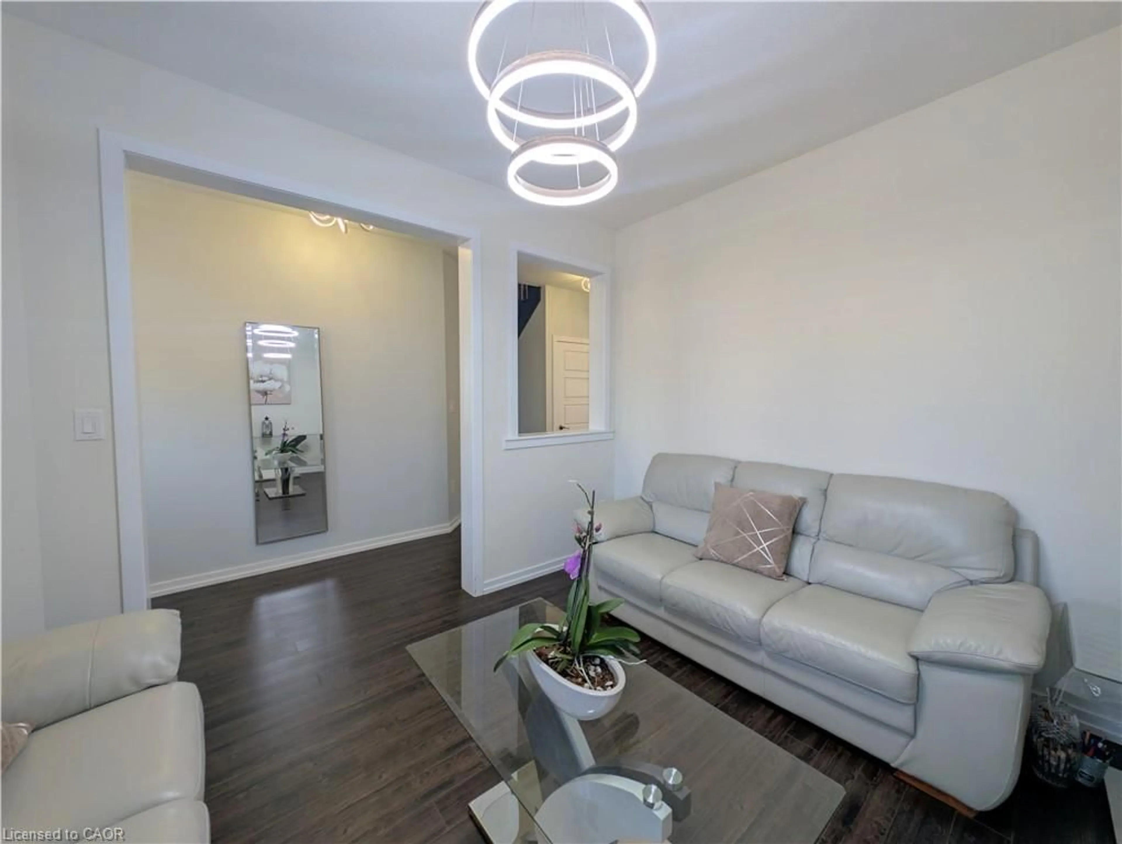 Living room with furniture, wood/laminate floor for 37 Mull Ave, Caledonia Ontario N3W 0B9