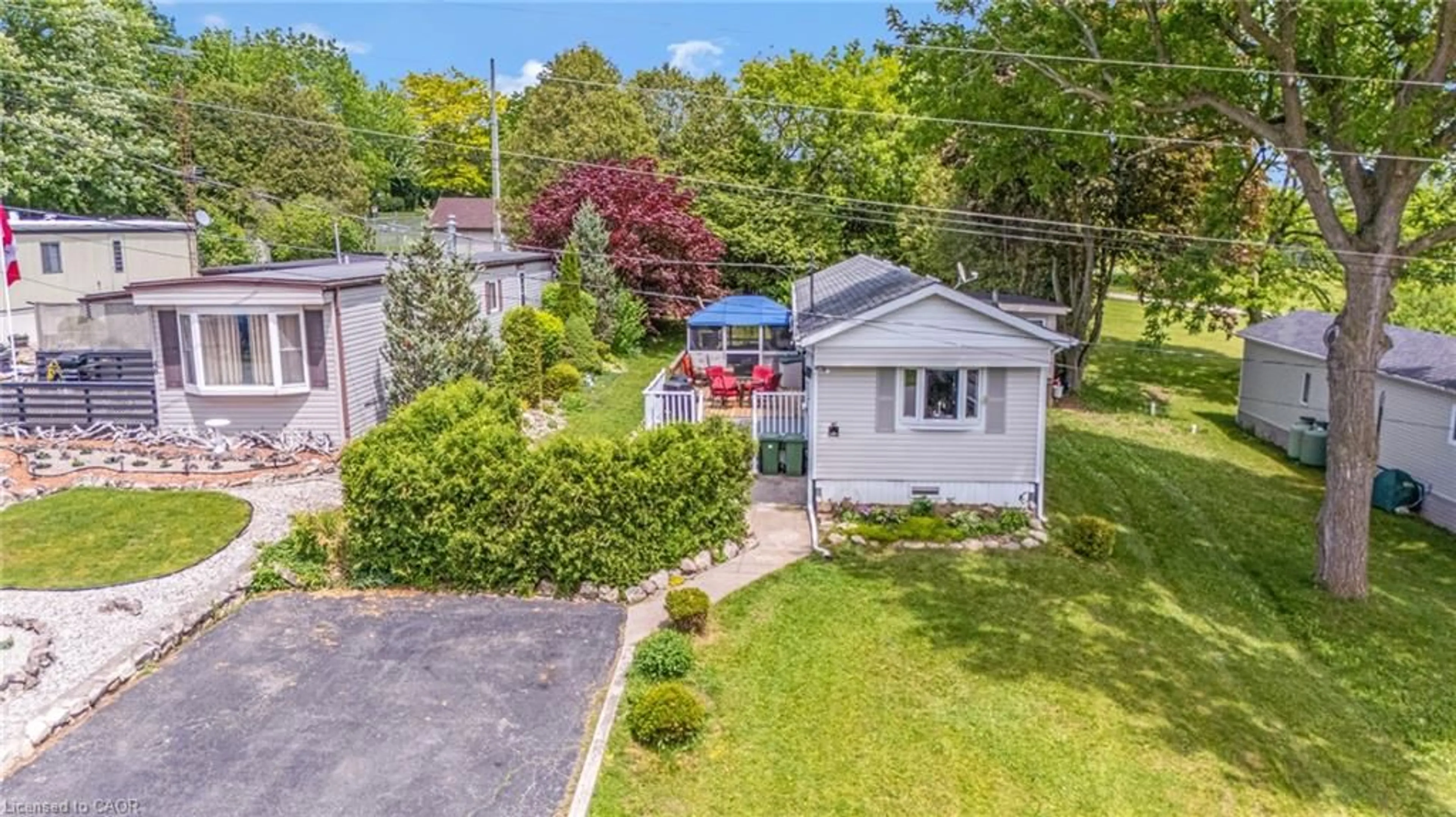 A pic from outside/outdoor area/front of a property/back of a property/a pic from drone, street for 49 Park Lane, Flamborough Ontario N0B 2J0