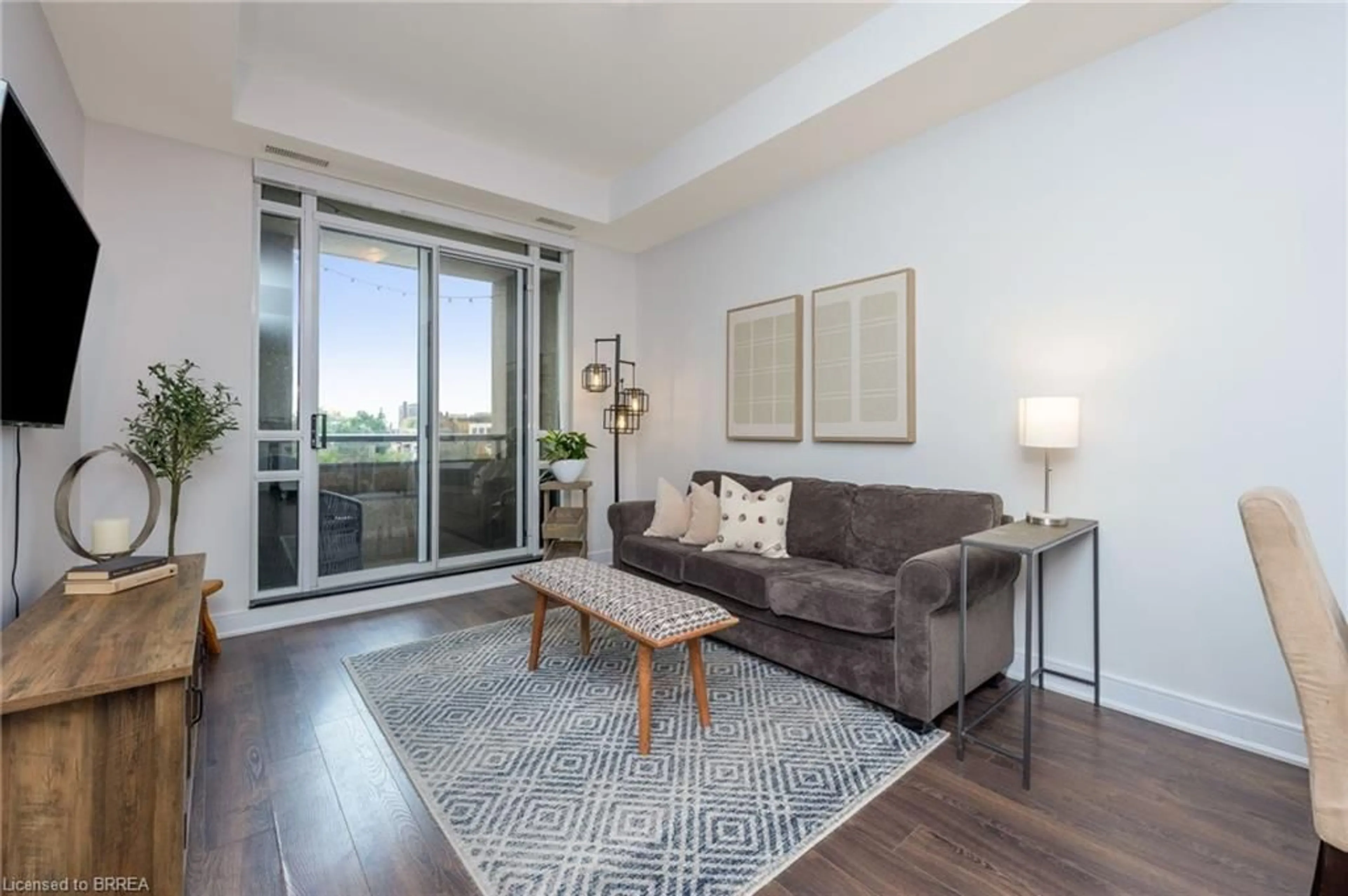Living room with furniture, unknown for 150 Main St #505, Hamilton Ontario L8P 1H8