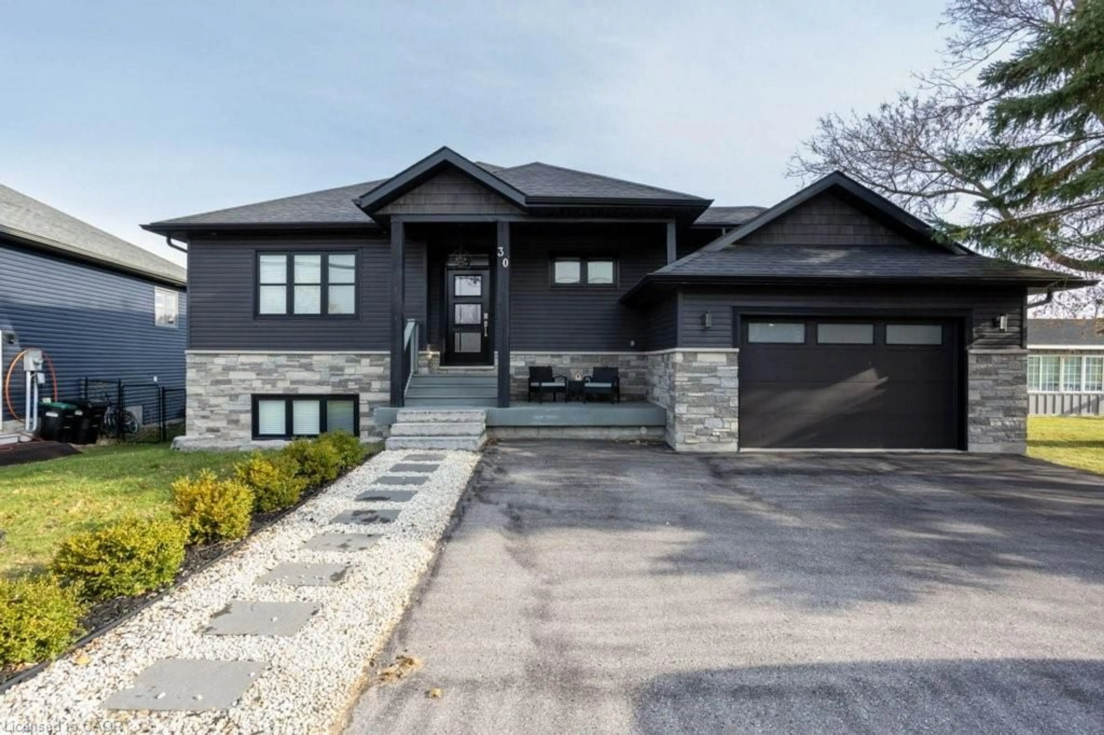 Home with brick exterior material, street for 30 Lakeshore Rd, Wasaga Beach Ontario L9Z 2Y3