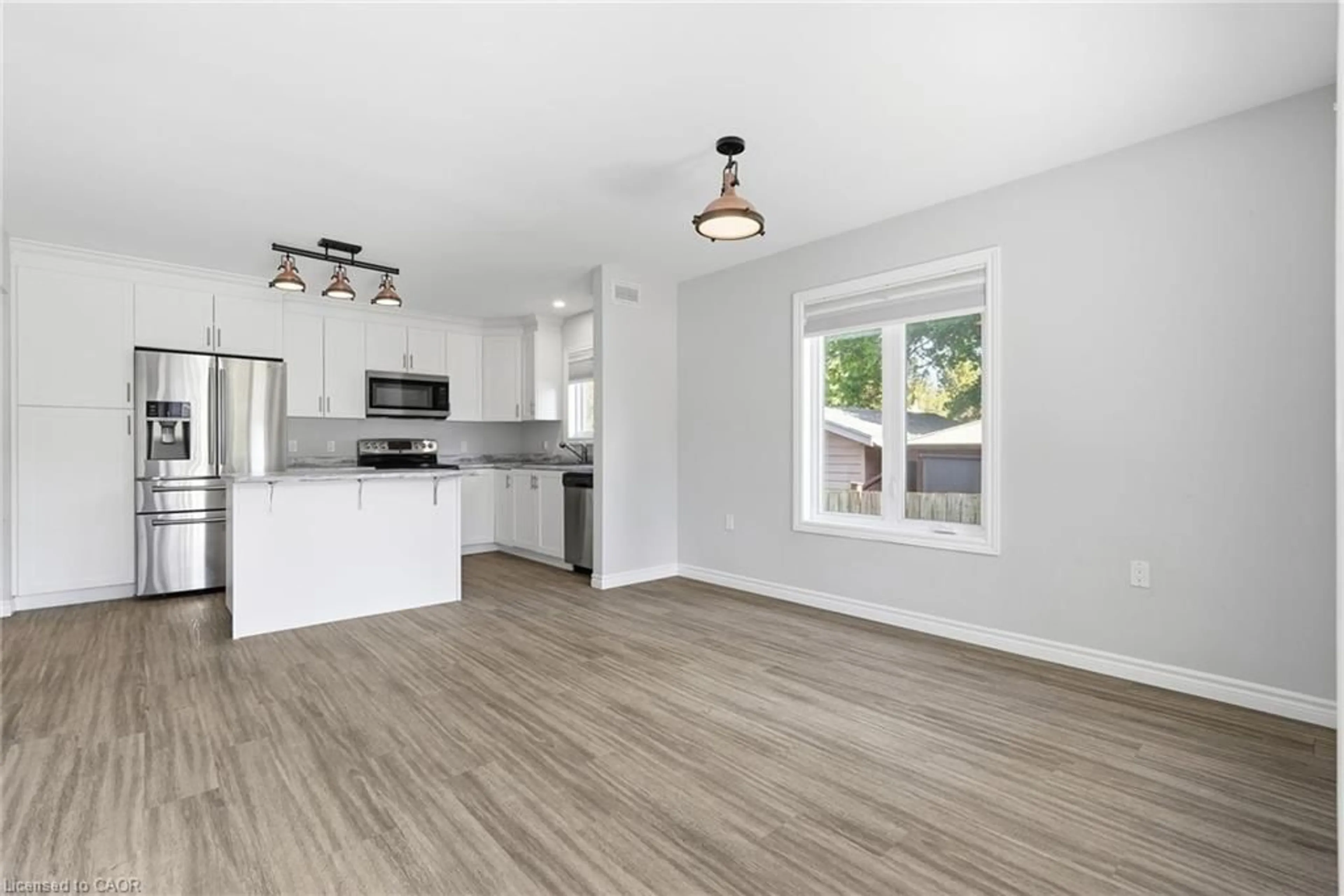 Open concept kitchen, wood/laminate floor for 645 Davidson Ave, Listowel Ontario N4W 0G7