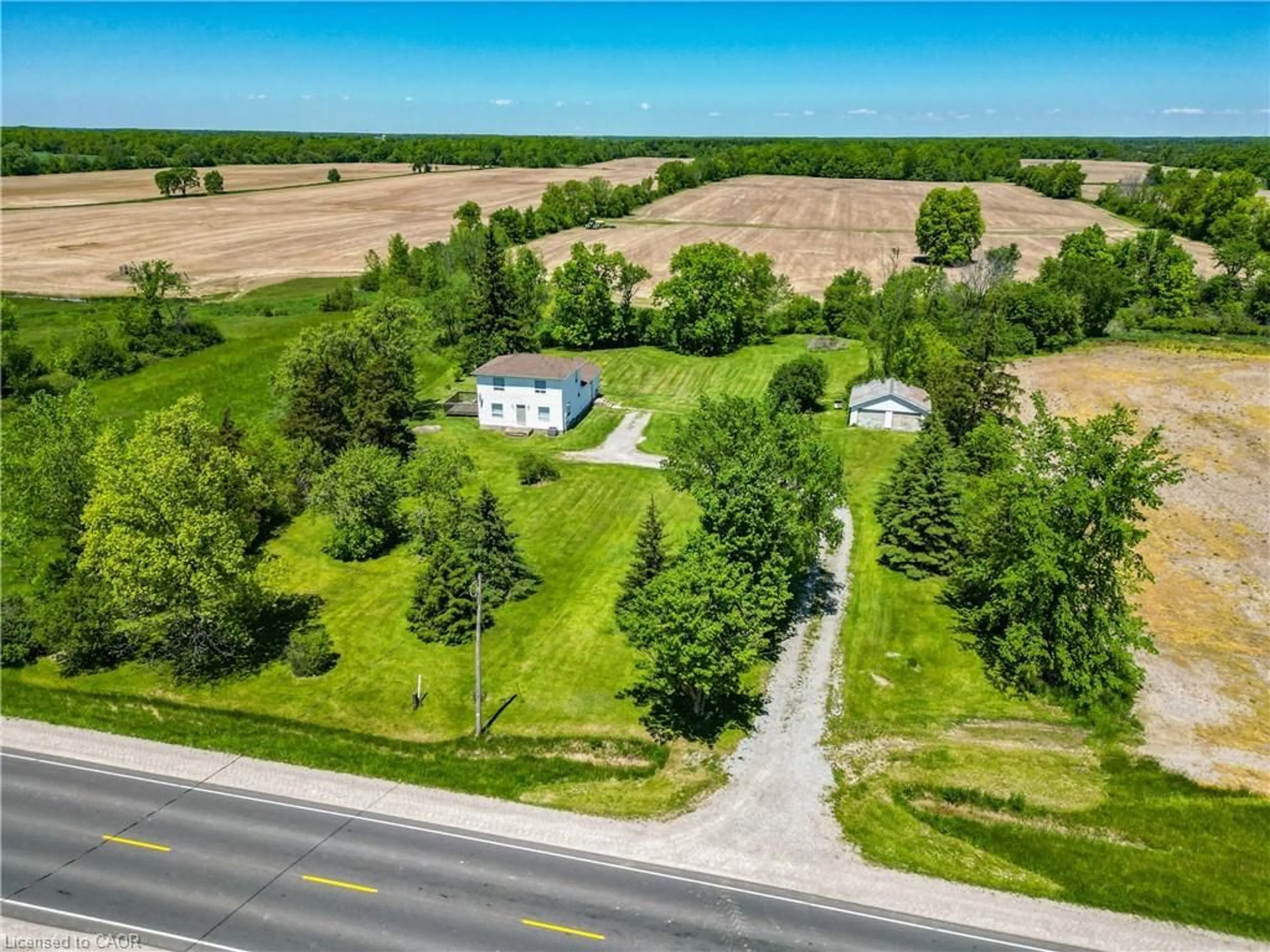 A pic from outside/outdoor area/front of a property/back of a property/a pic from drone, street for 6569 Highway 3, Dunnville Ontario N0A 1C0