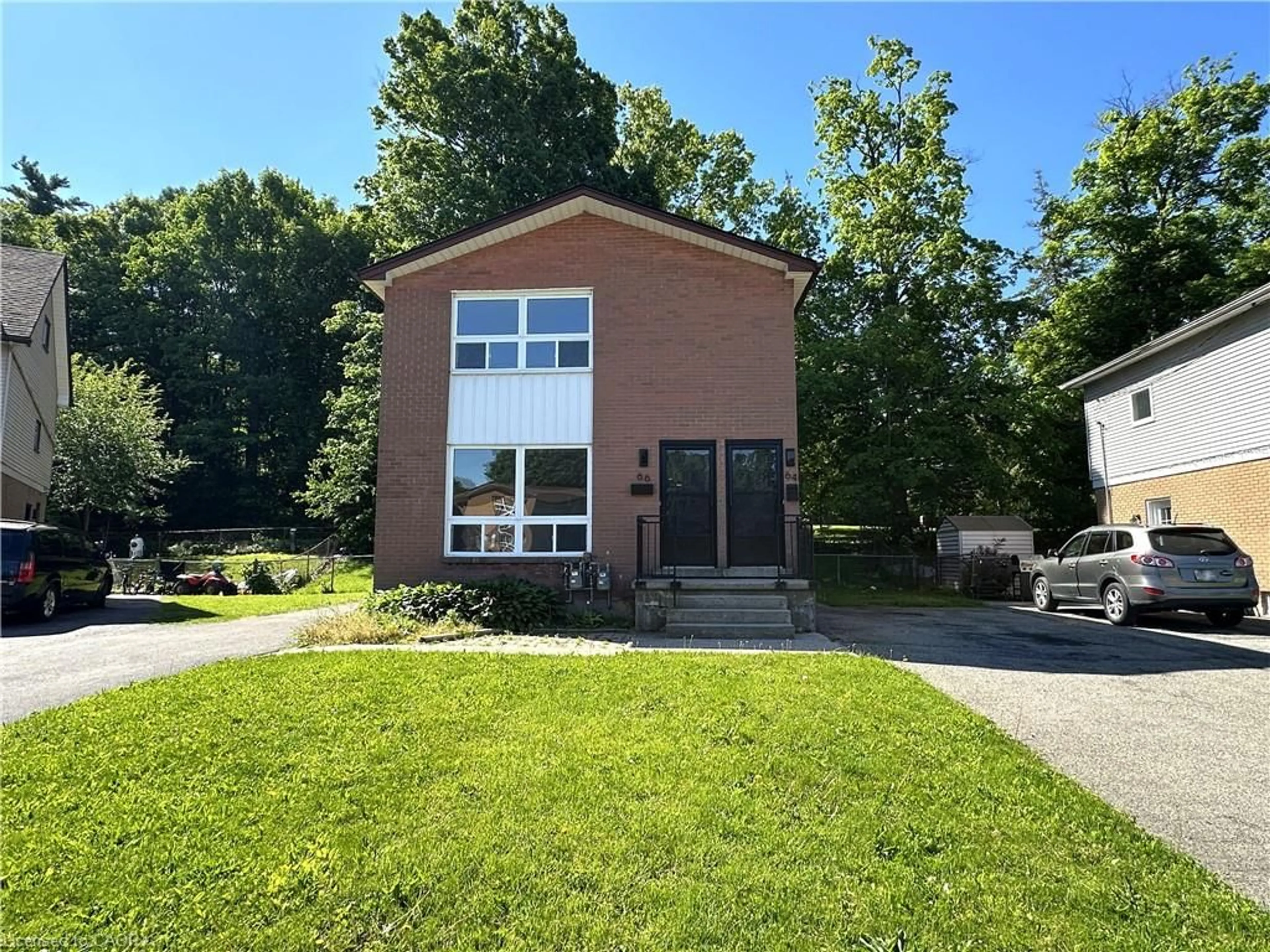 Home with brick exterior material, street for 64-66 Oakwood Ave, Simcoe Ontario N3Y 1H6