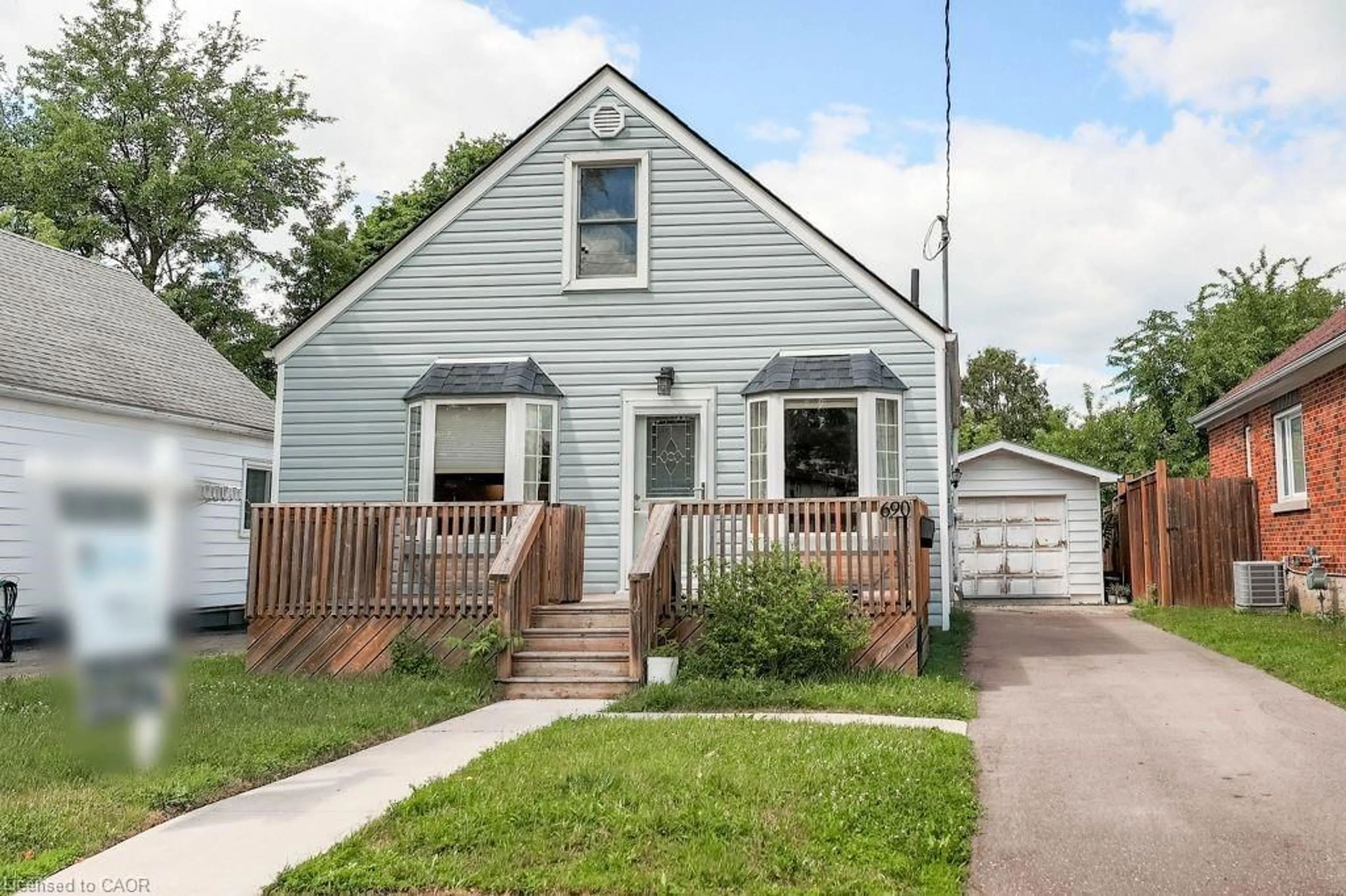 Home with vinyl exterior material, street for 690 Guelph St, Kitchener Ontario N2H 5Y9