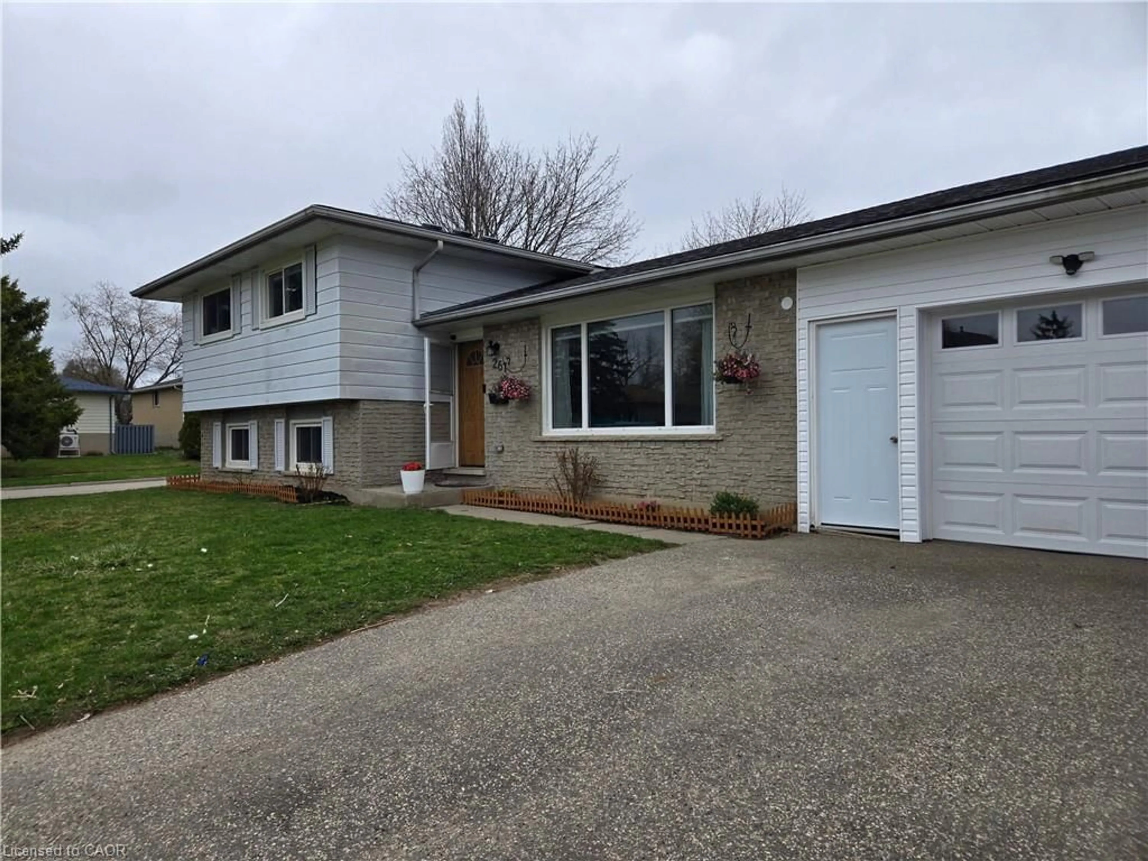 Home with vinyl exterior material, street for 261 Overlea Dr, Kitchener Ontario N2M 1T7