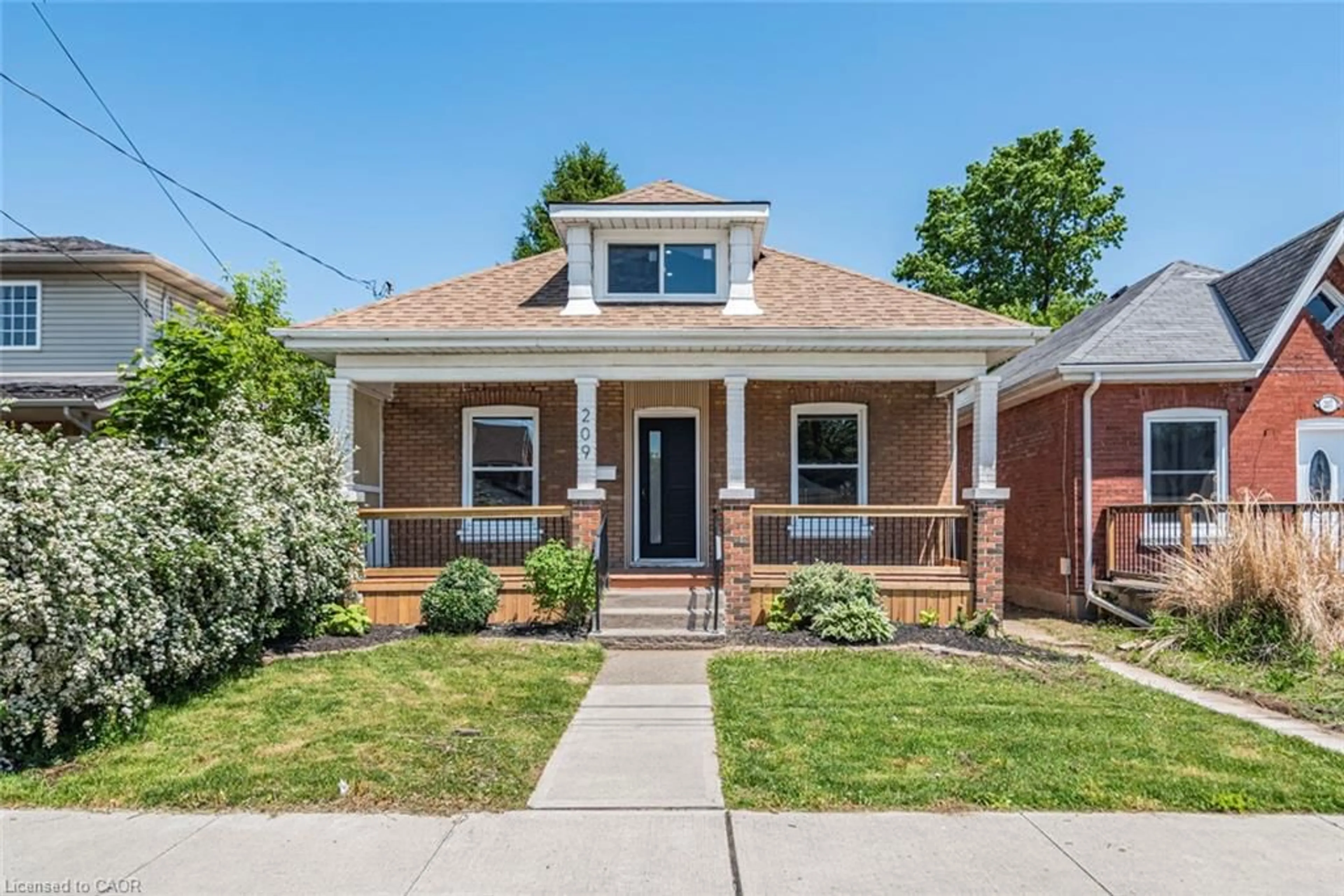 Home with brick exterior material, street for 209 Drummond St, Brantford Ontario N3S 6B1