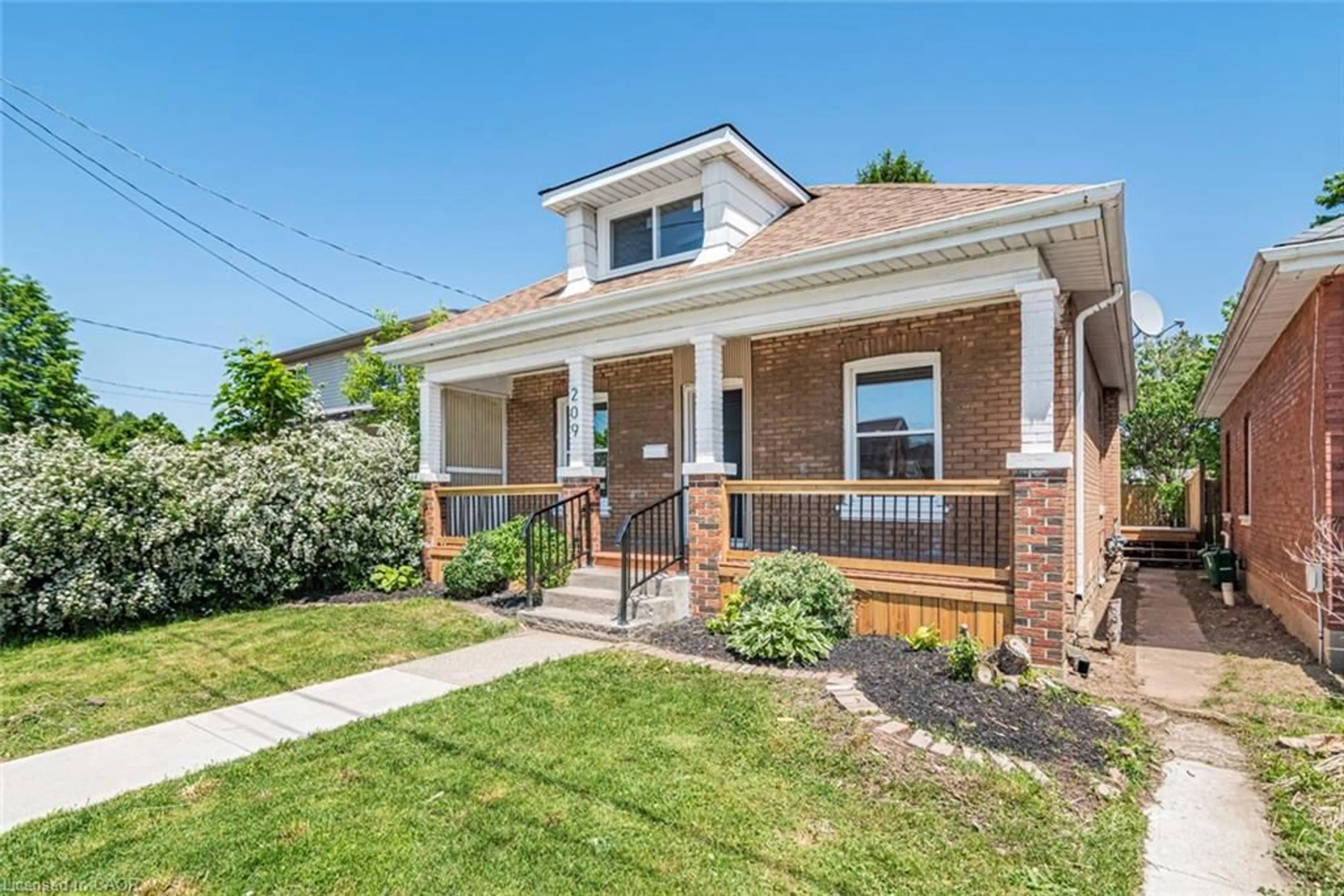 Home with brick exterior material, street for 209 Drummond St, Brantford Ontario N3S 6B1