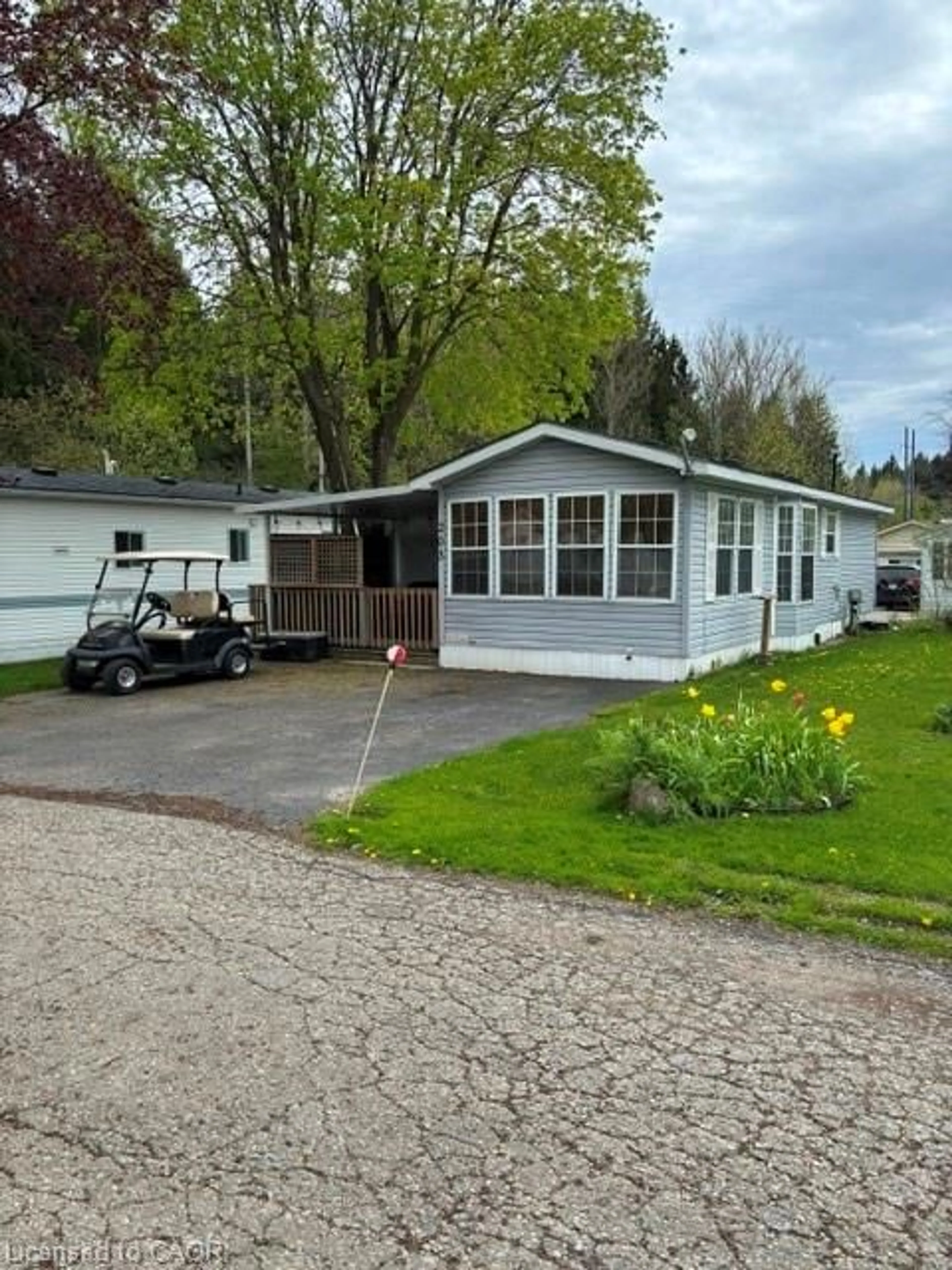 Home with vinyl exterior material, street for 580 Beaver Creek Rd #203, Waterloo Ontario N2J 3Z4