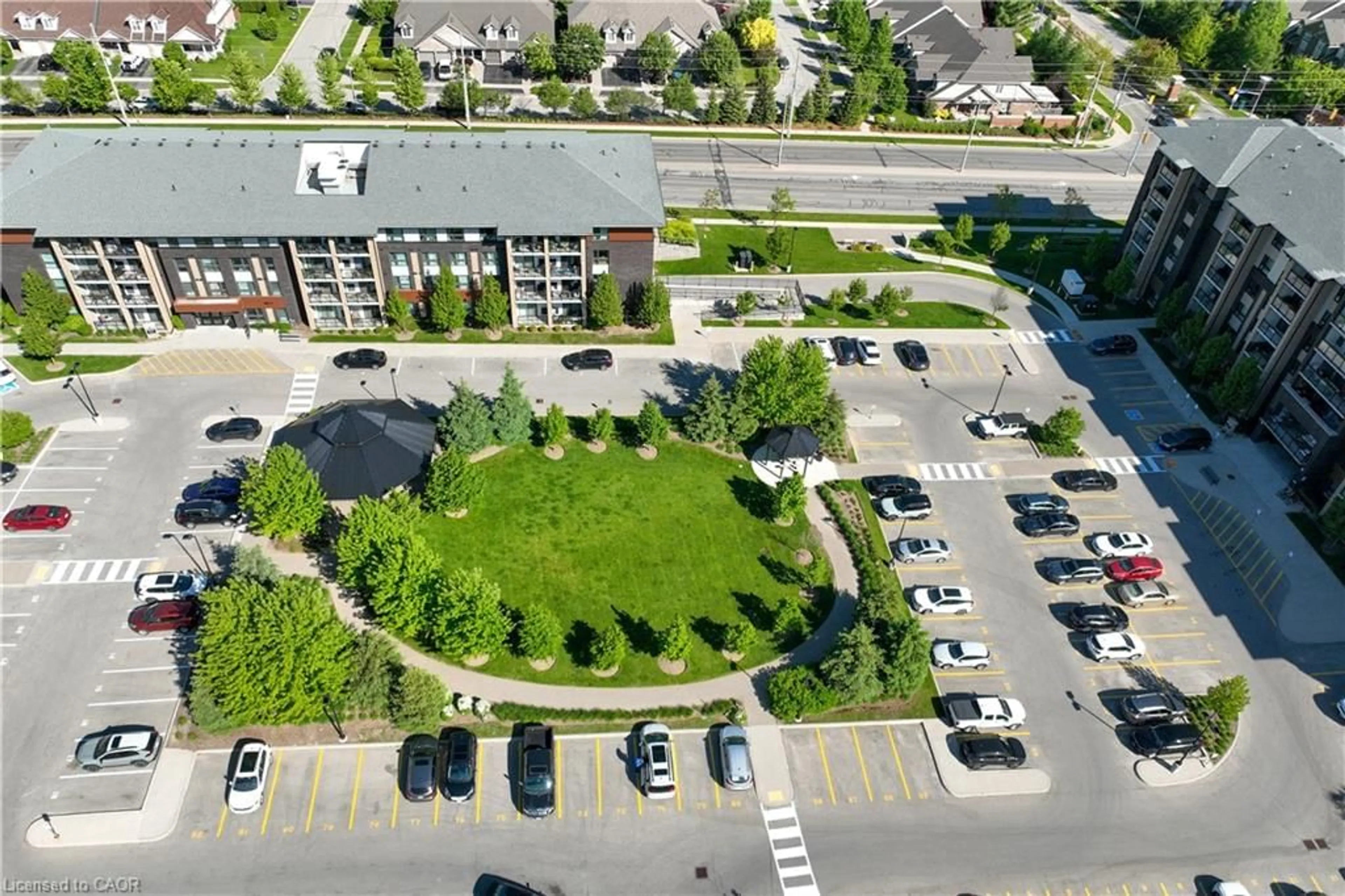 A pic from outside/outdoor area/front of a property/back of a property/a pic from drone, street for 7 Kay Cres #107, Guelph Ontario N1L 0L9