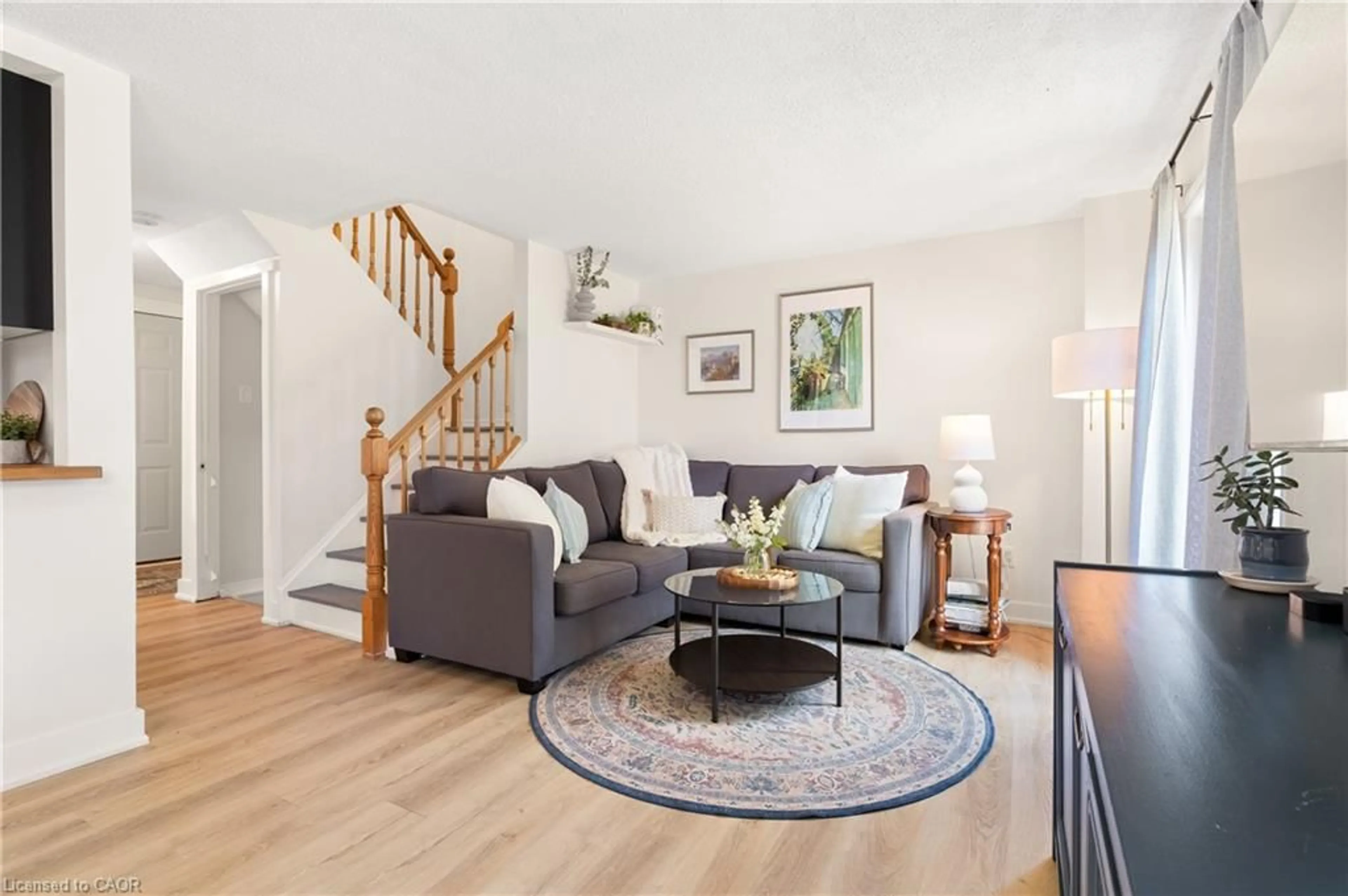 Living room with furniture, wood/laminate floor for 52 Walman Dr, Guelph Ontario N1G 4H4