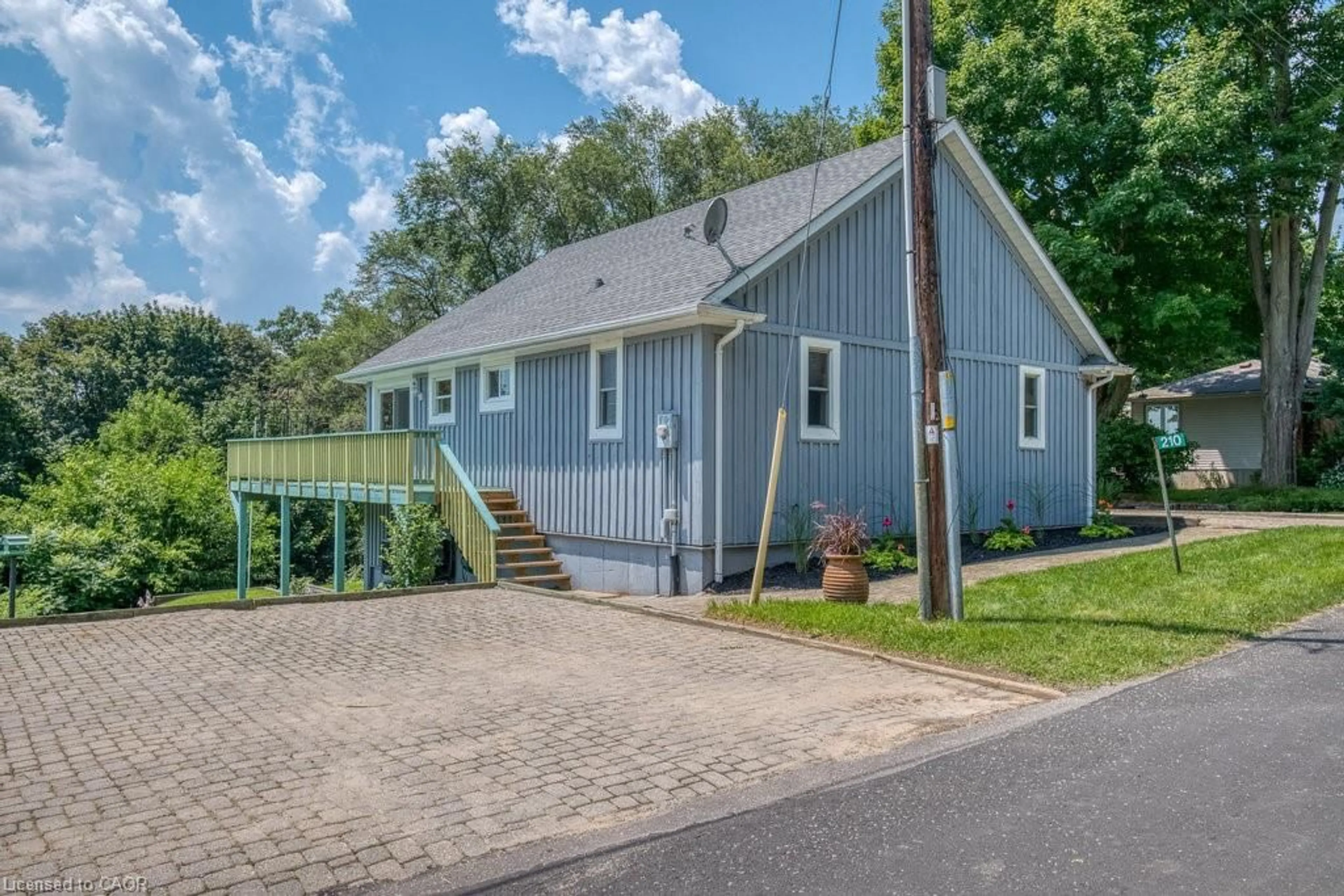 Home with vinyl exterior material, street for 210 Hillside Ave, Normandale Ontario N0E 1T0
