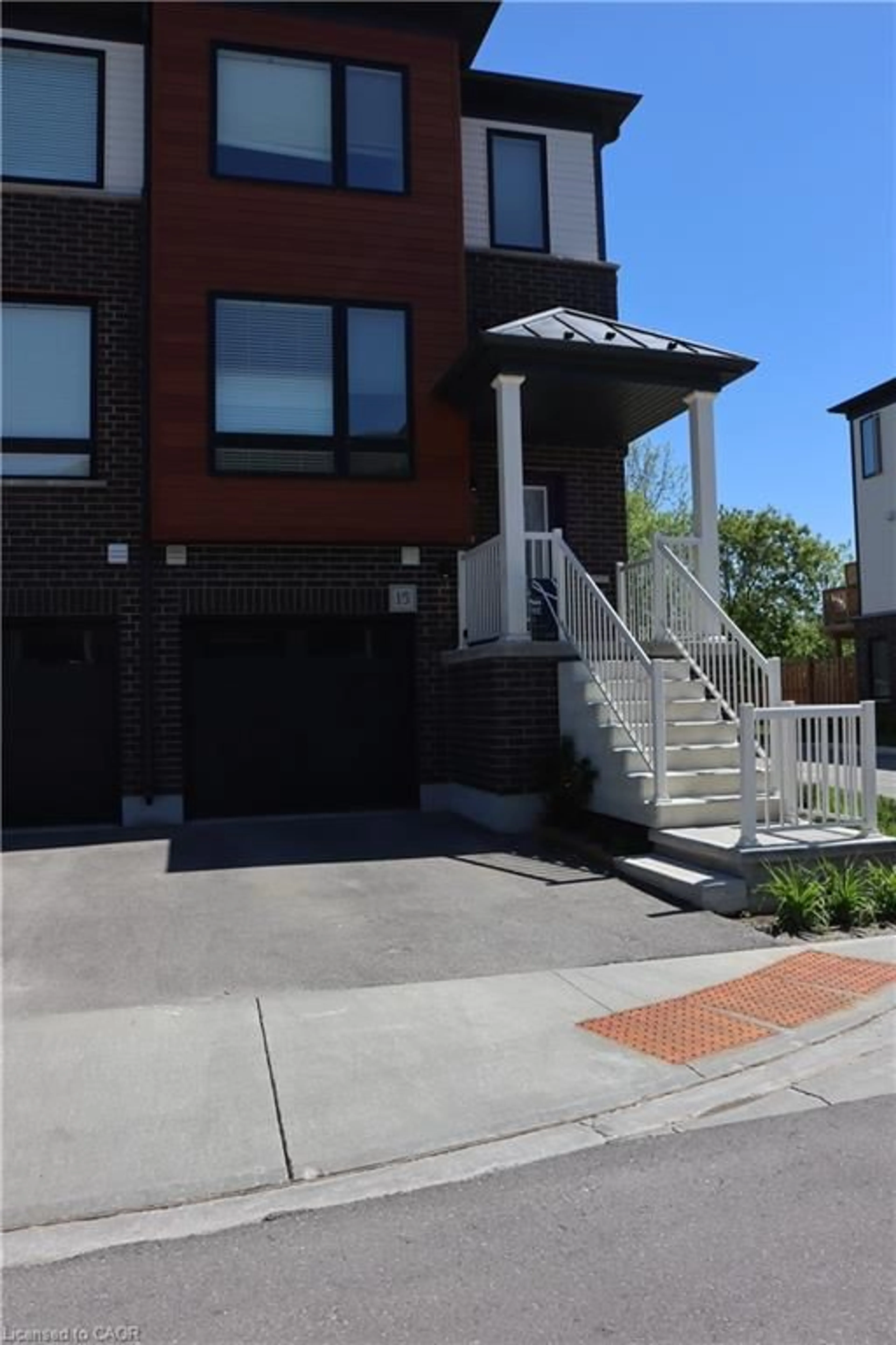 Home with brick exterior material, street for 15 Sora Lane, Guelph Ontario N1E 0T4