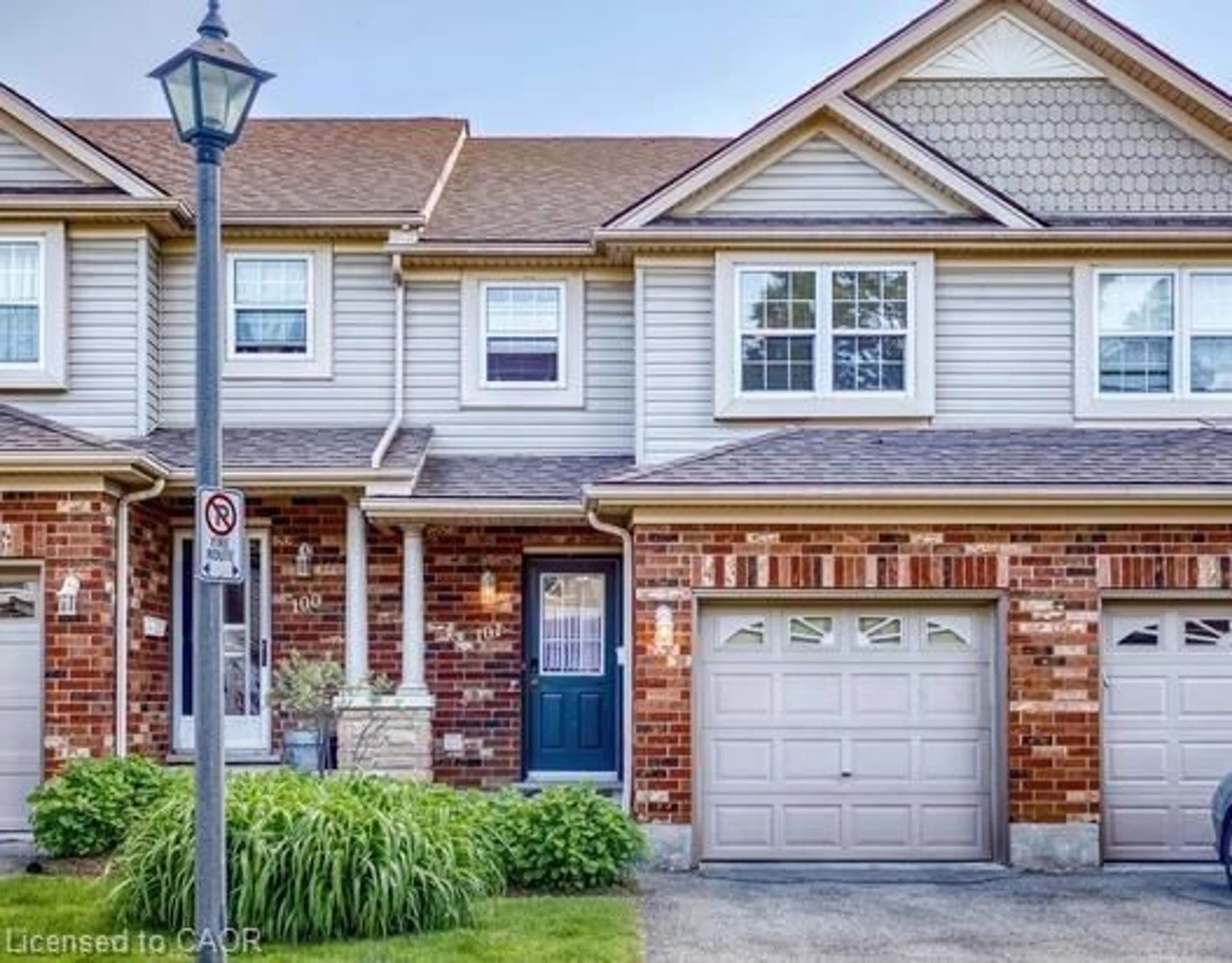 Home with brick exterior material, street for 30 Imperial Rd #101, Guelph Ontario N1K 1Y5