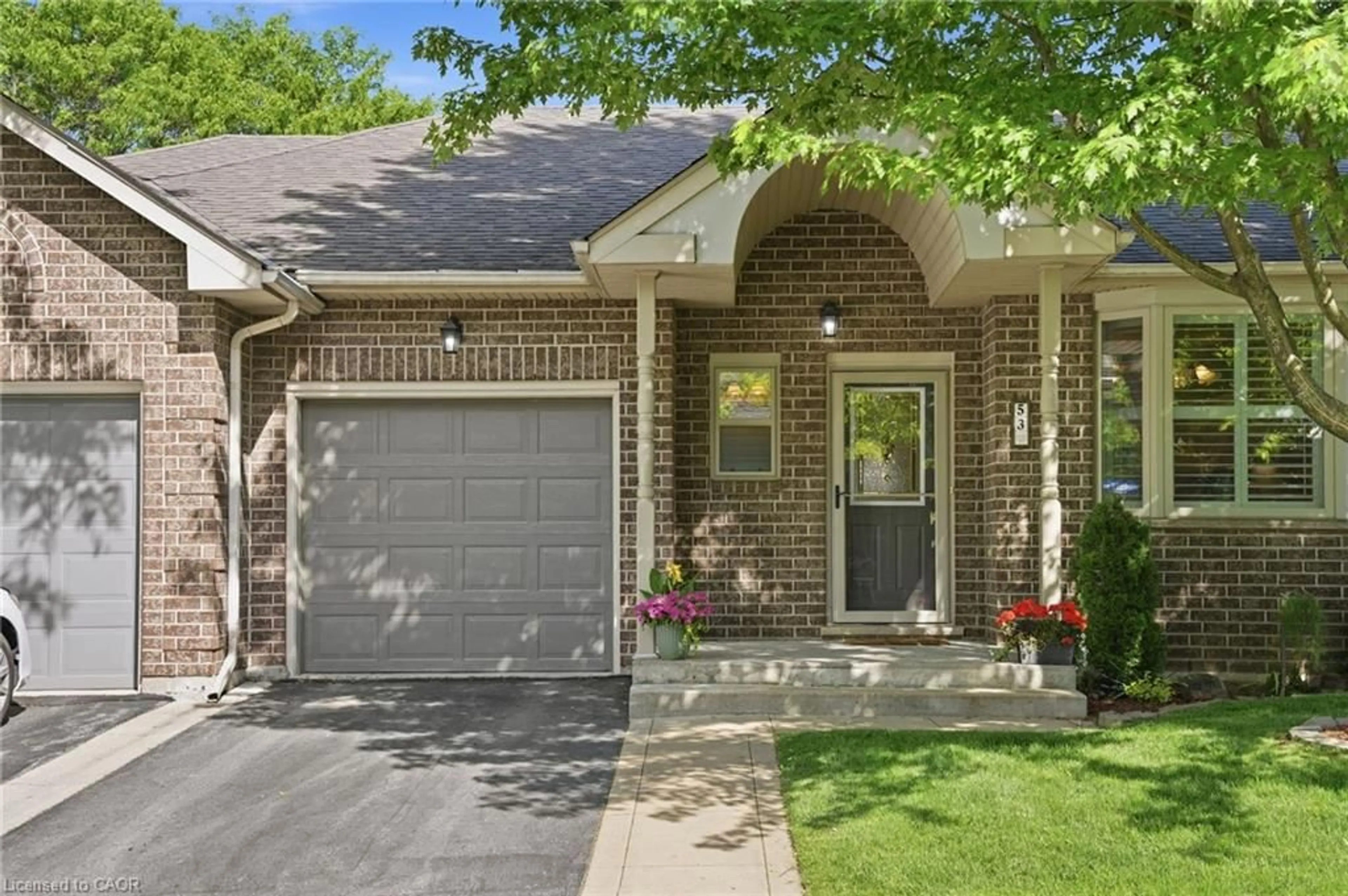 Home with brick exterior material, street for 53 Greentrail Dr, Mount Hope Ontario L0R 1W0