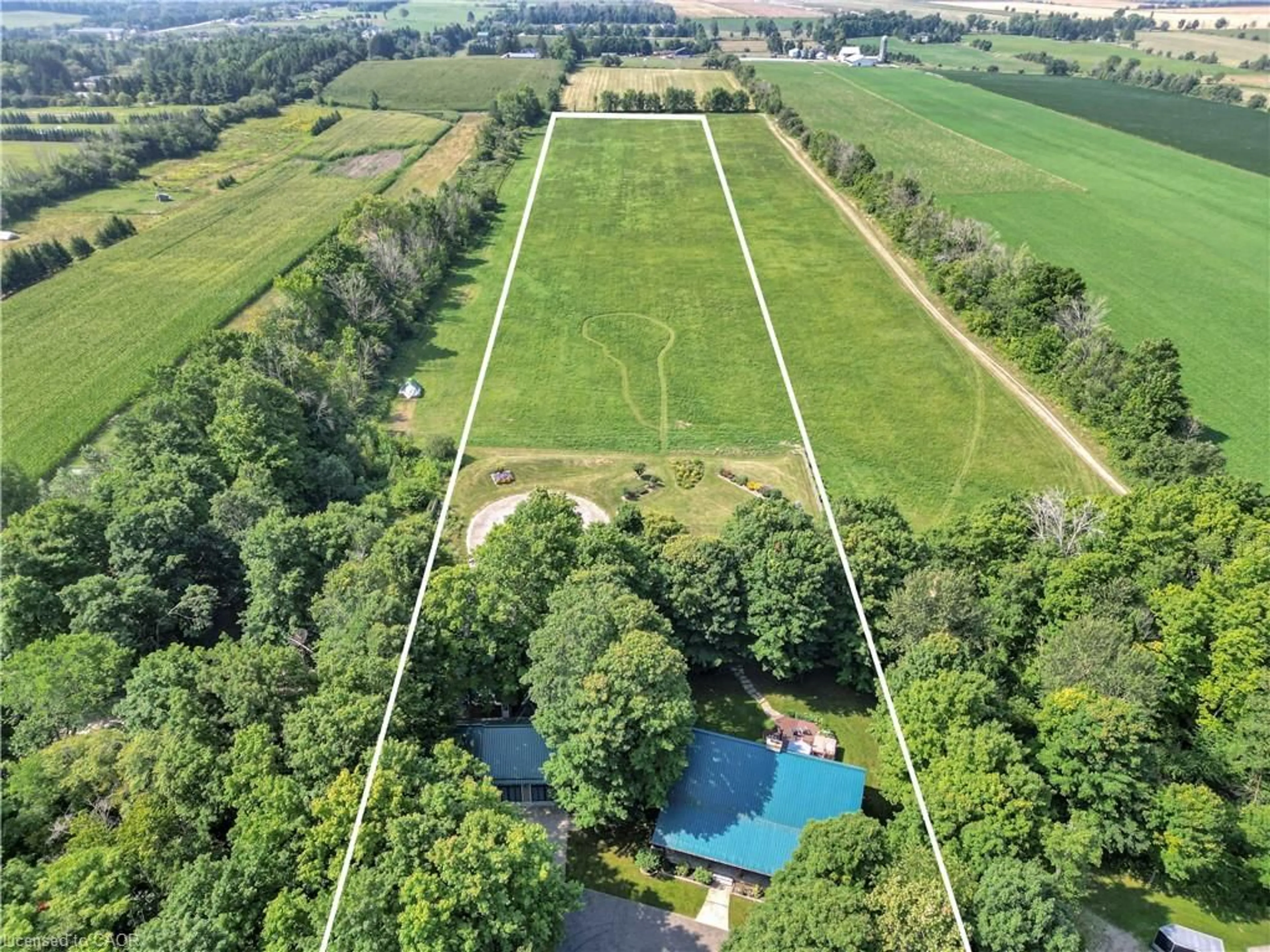 A pic from outside/outdoor area/front of a property/back of a property/a pic from drone, water/lake/river/ocean view for 8036 Wellington Rd 7, Moorefield Ontario N0G 2K0