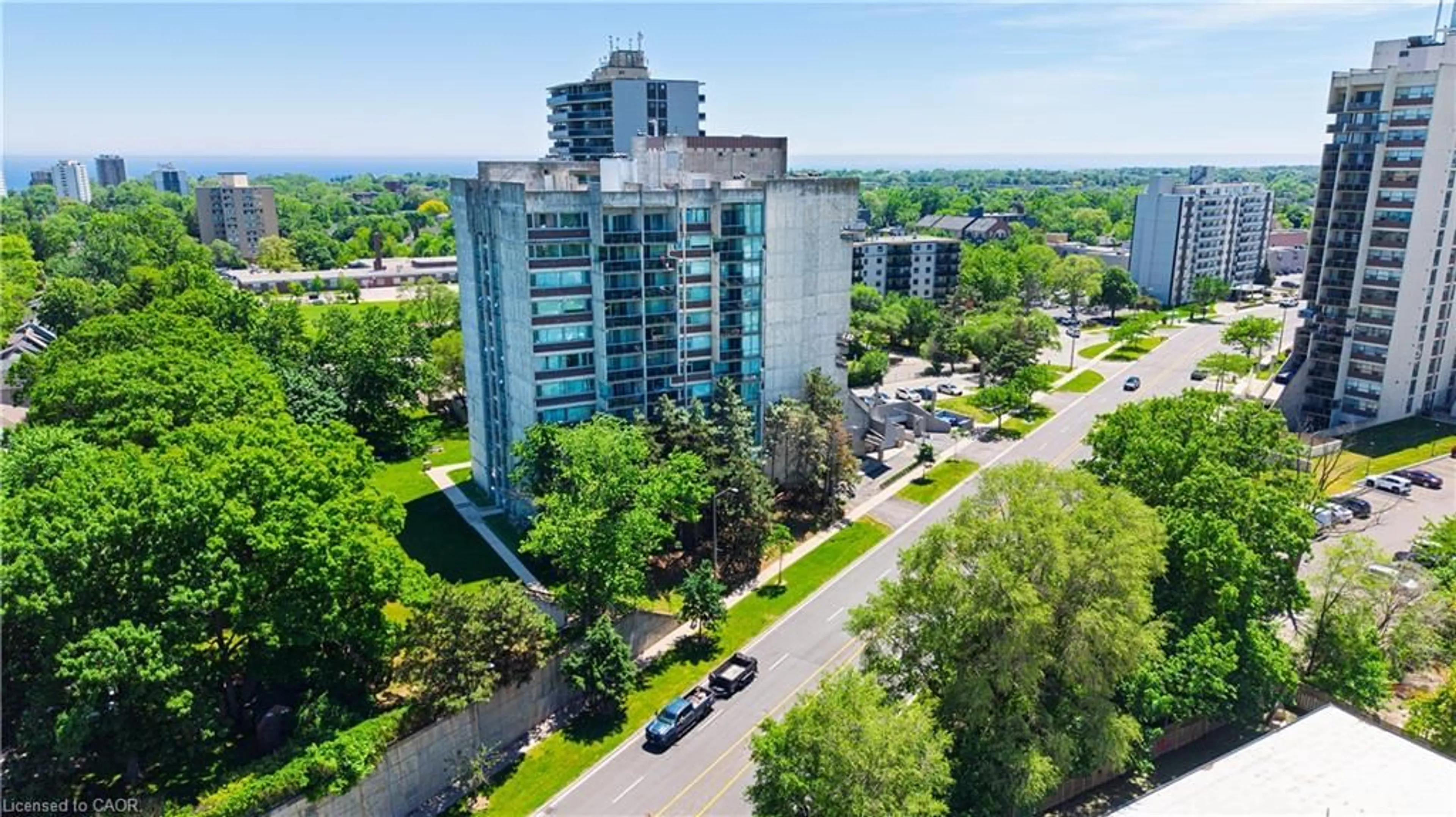 A pic from outside/outdoor area/front of a property/back of a property/a pic from drone, city buildings view from balcony for 20 Speers Rd #304, Oakville Ontario L6K 3R5