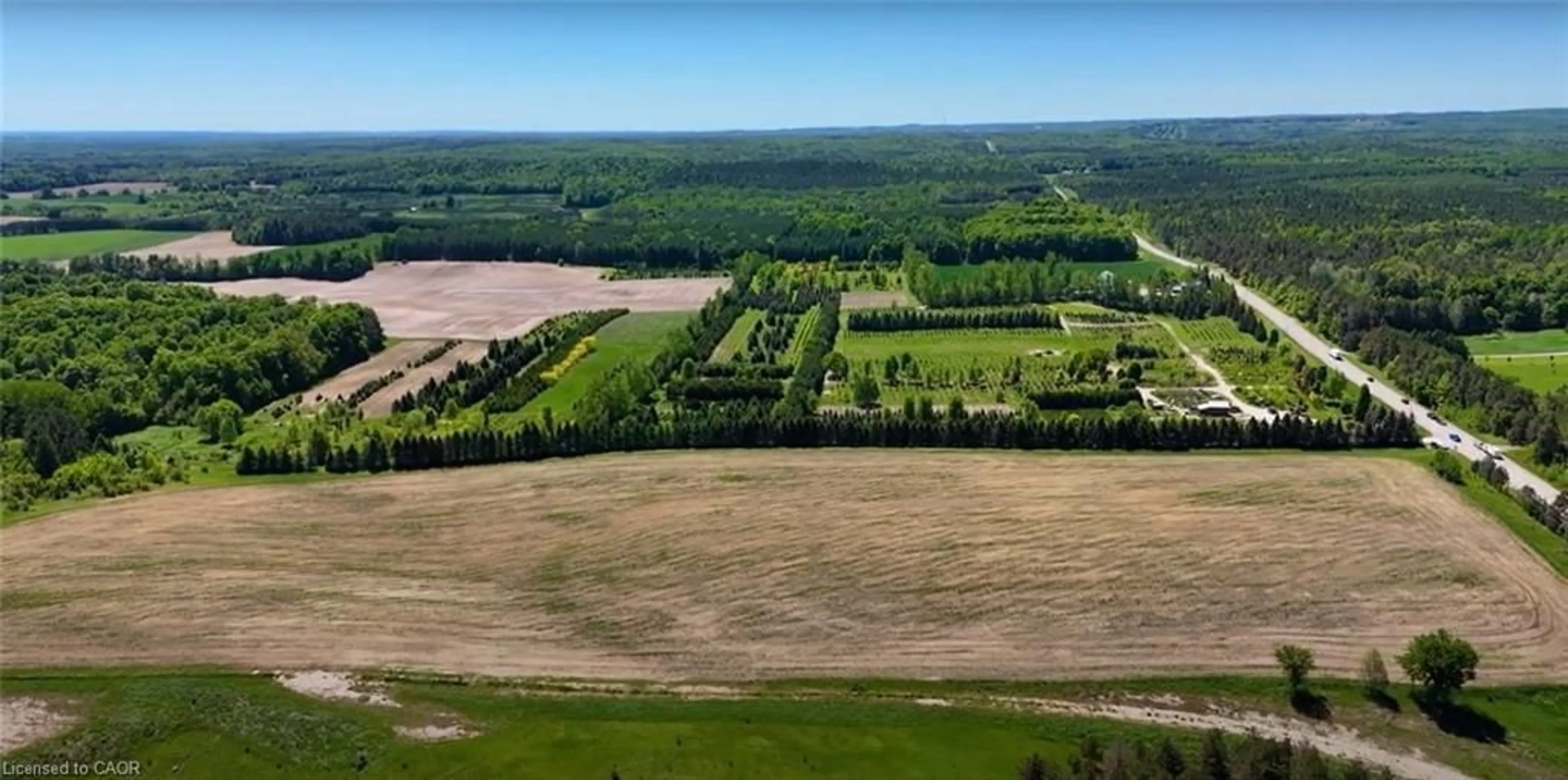 A pic from outside/outdoor area/front of a property/back of a property/a pic from drone, forest/trees view for 938453 Airport Rd R Rd, Mulmur Ontario L0M 1K0