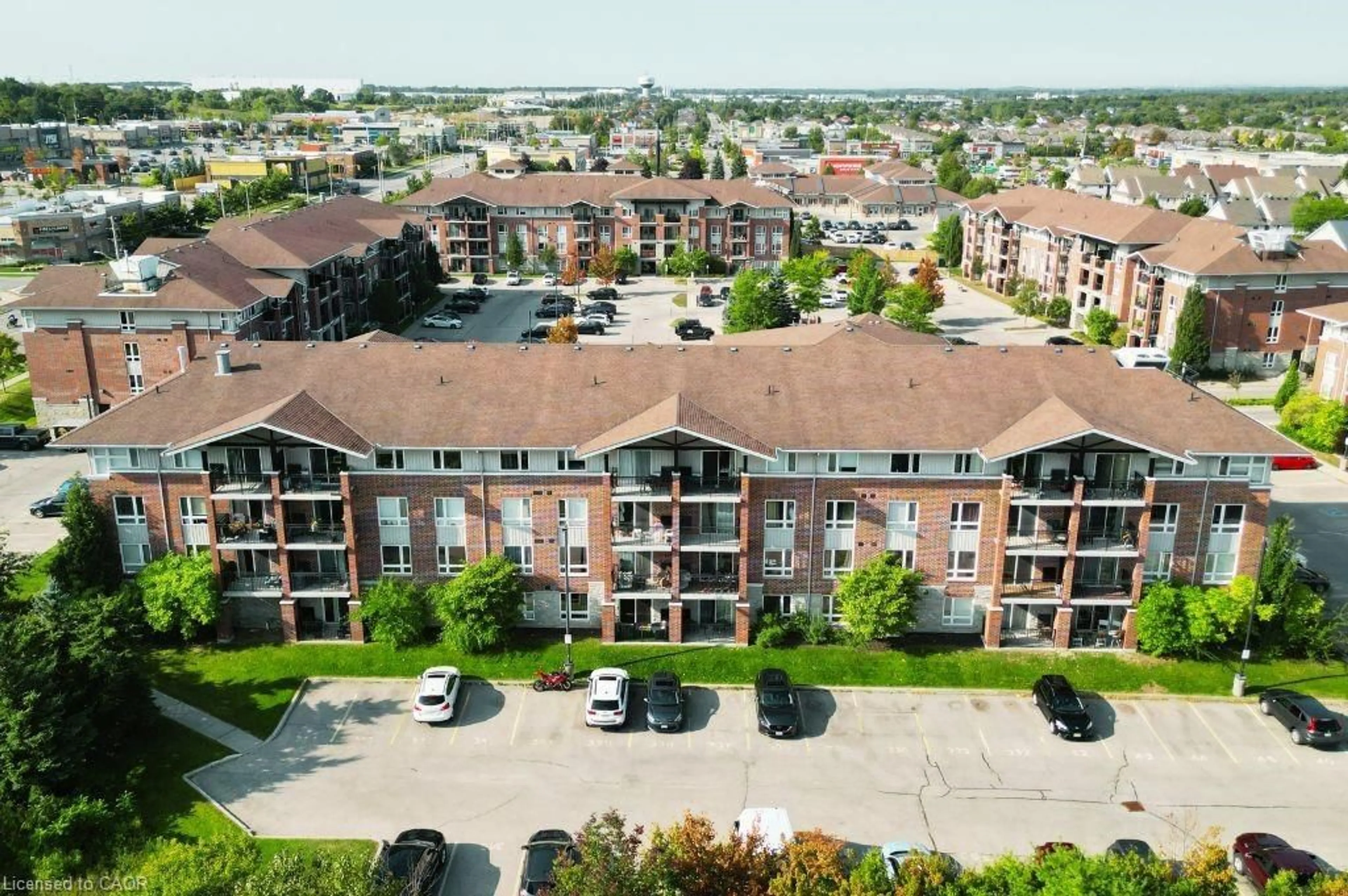 A pic from outside/outdoor area/front of a property/back of a property/a pic from drone, city buildings view from balcony for 41 Goodwin Dr #202, Guelph Ontario N1L 0E7