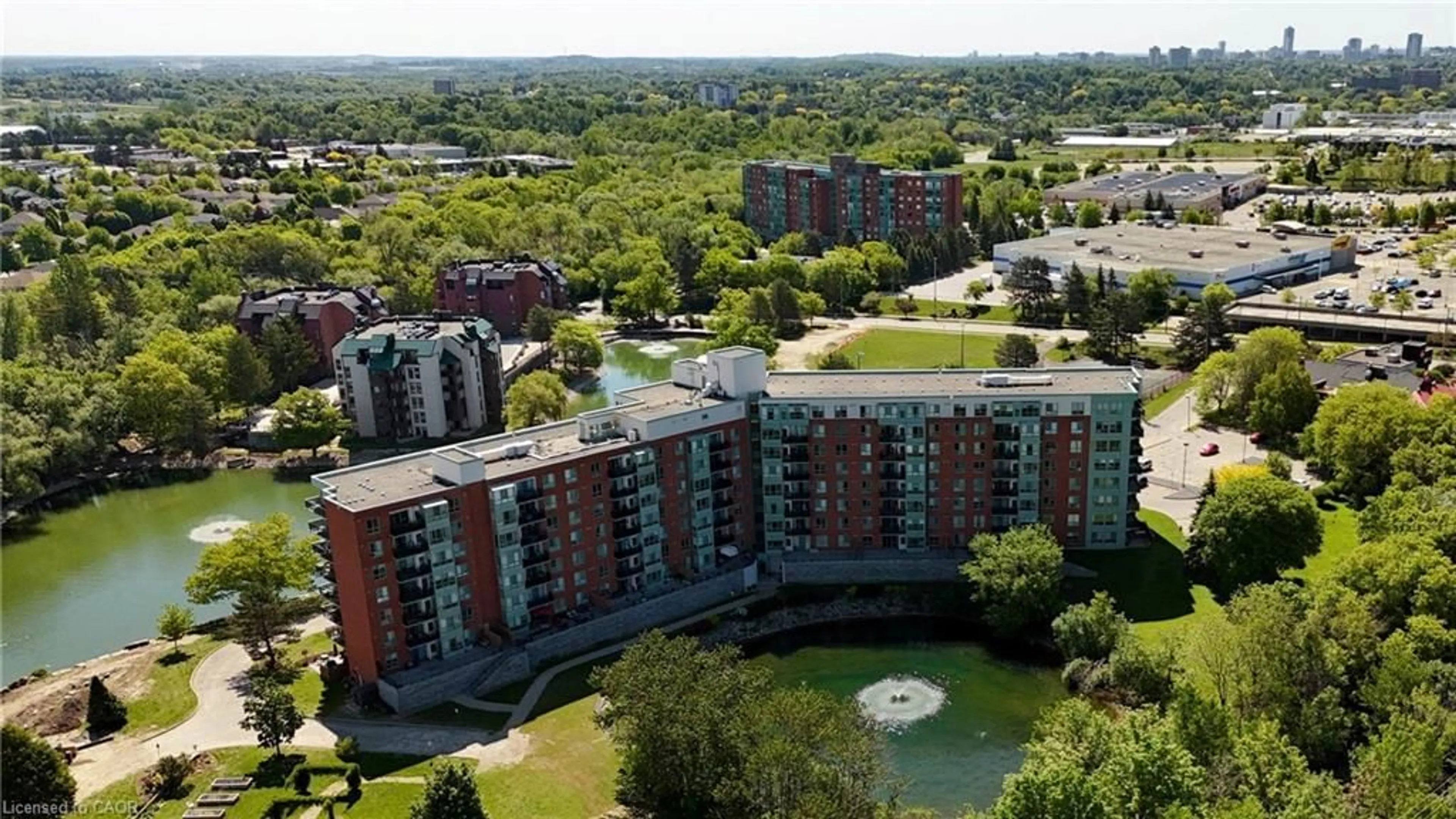 A pic from outside/outdoor area/front of a property/back of a property/a pic from drone, city buildings view from balcony for 30 Blue Springs Dr #102, Waterloo Ontario N2J 4T2