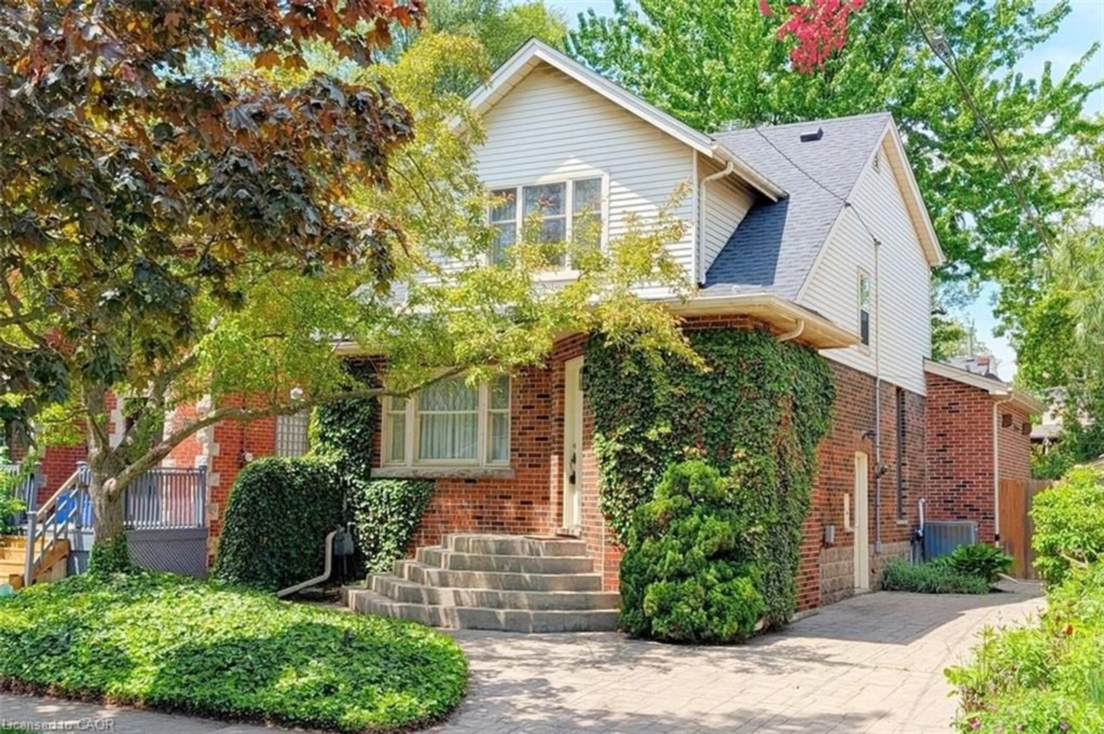 Home with brick exterior material, street for 12 Bond St, Hamilton Ontario L8S 1S7