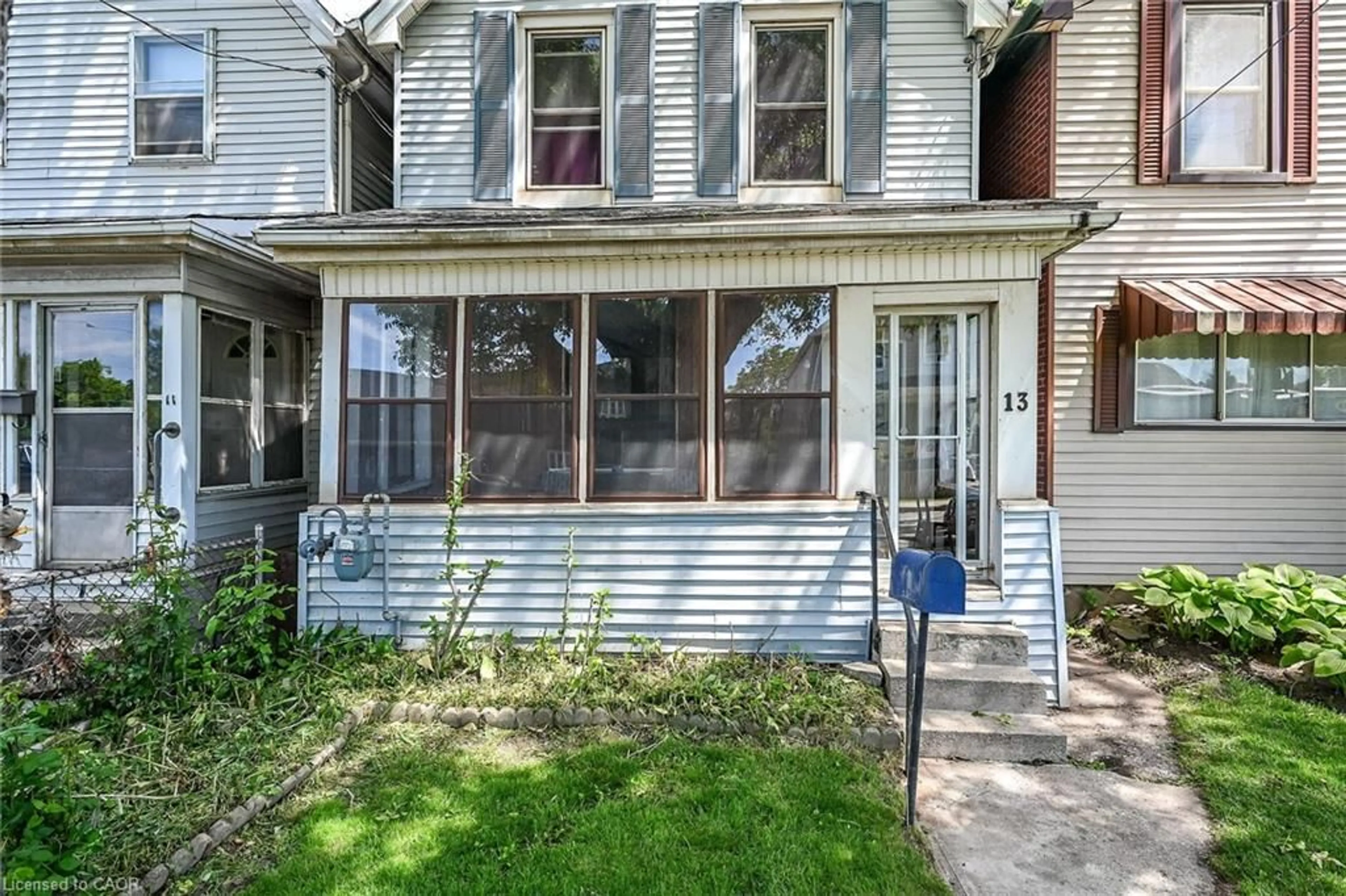 Home with vinyl exterior material, street for 13 Brant St, Hamilton Ontario L8L 4C5
