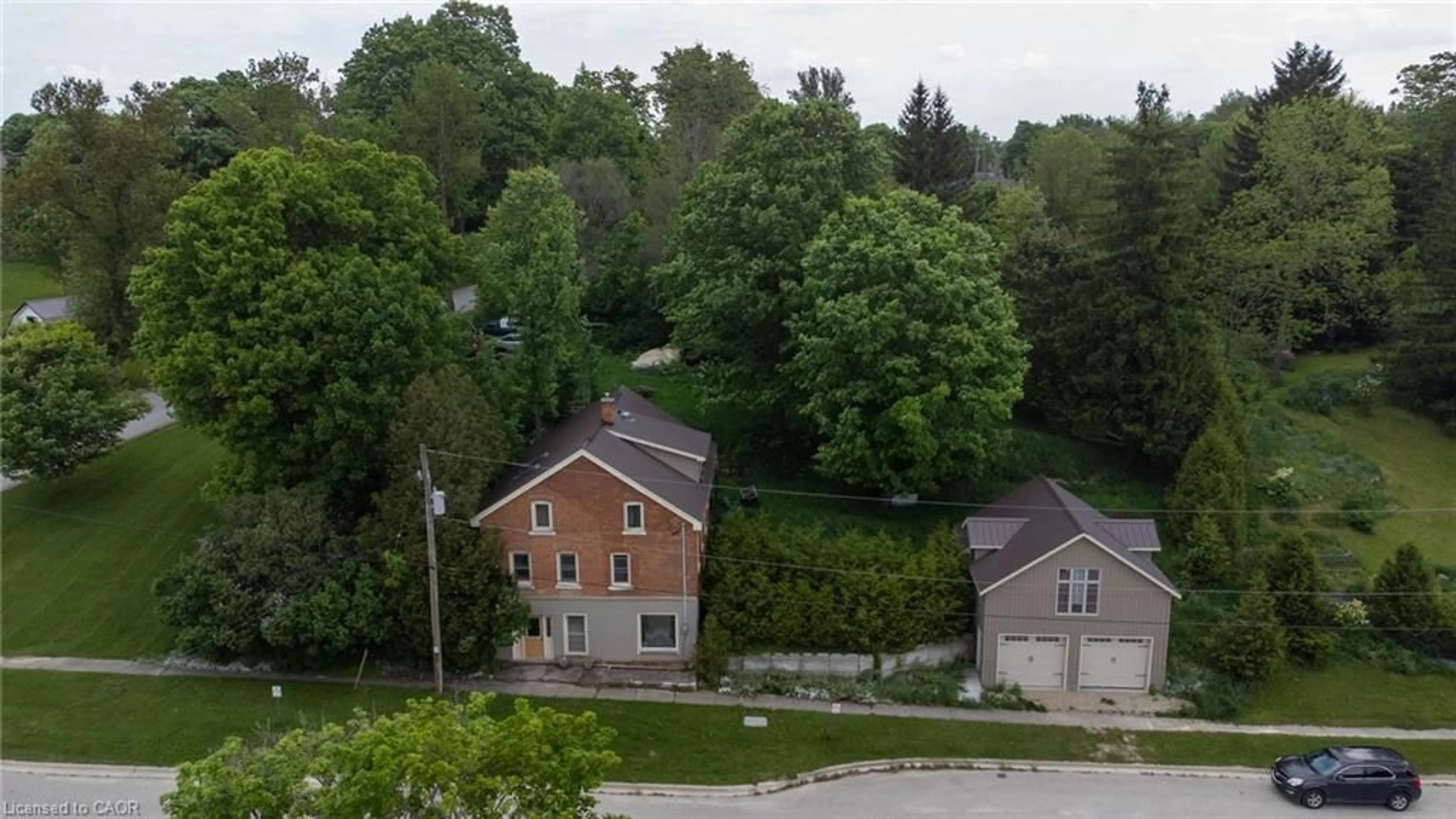 A pic from outside/outdoor area/front of a property/back of a property/a pic from drone, street for 3095 Old Mill St, Fordwich Ontario N0G 1V0