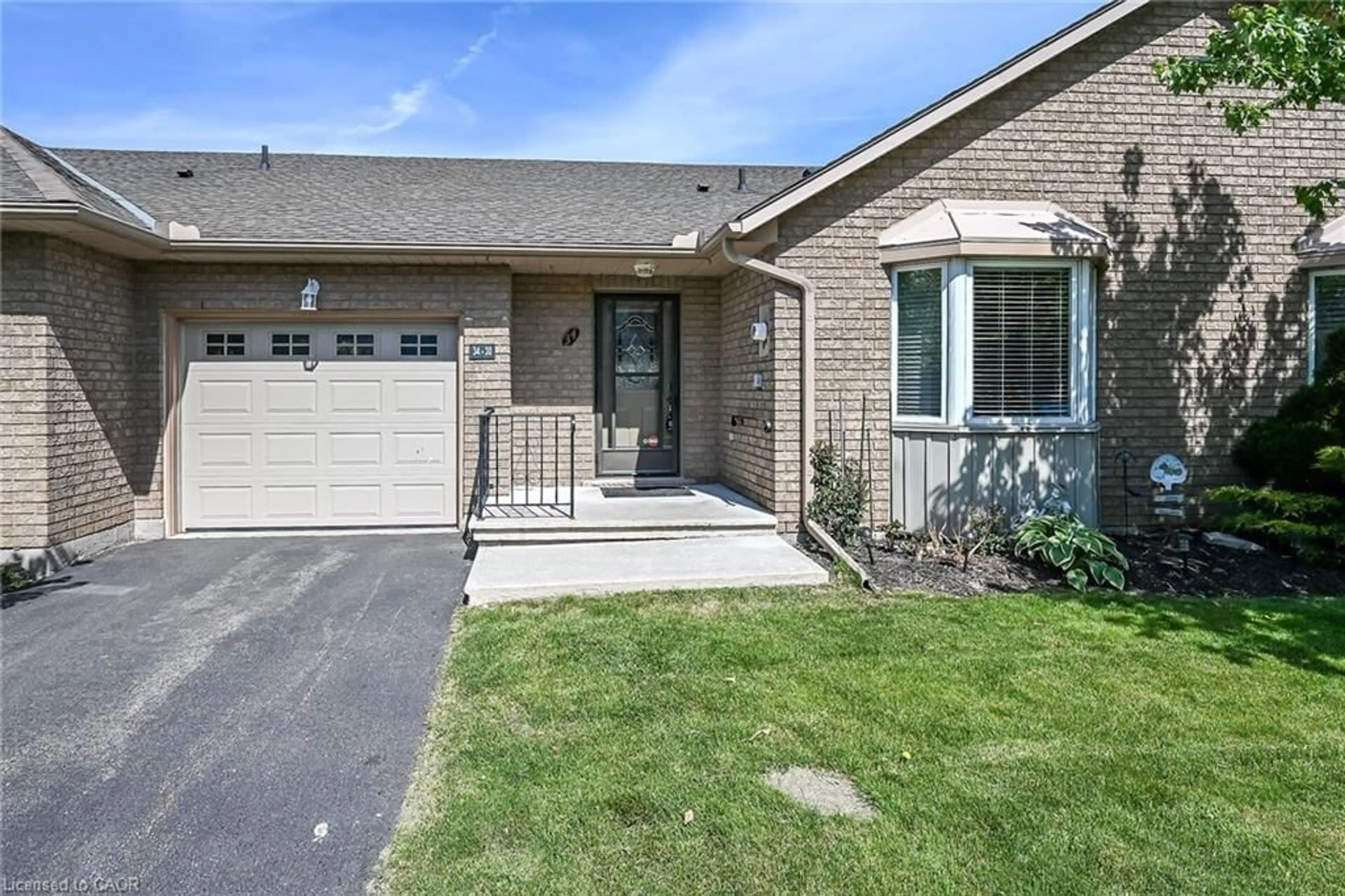 Home with brick exterior material, street for 30 Braemar Ave #34, Caledonia Ontario N3W 2M1