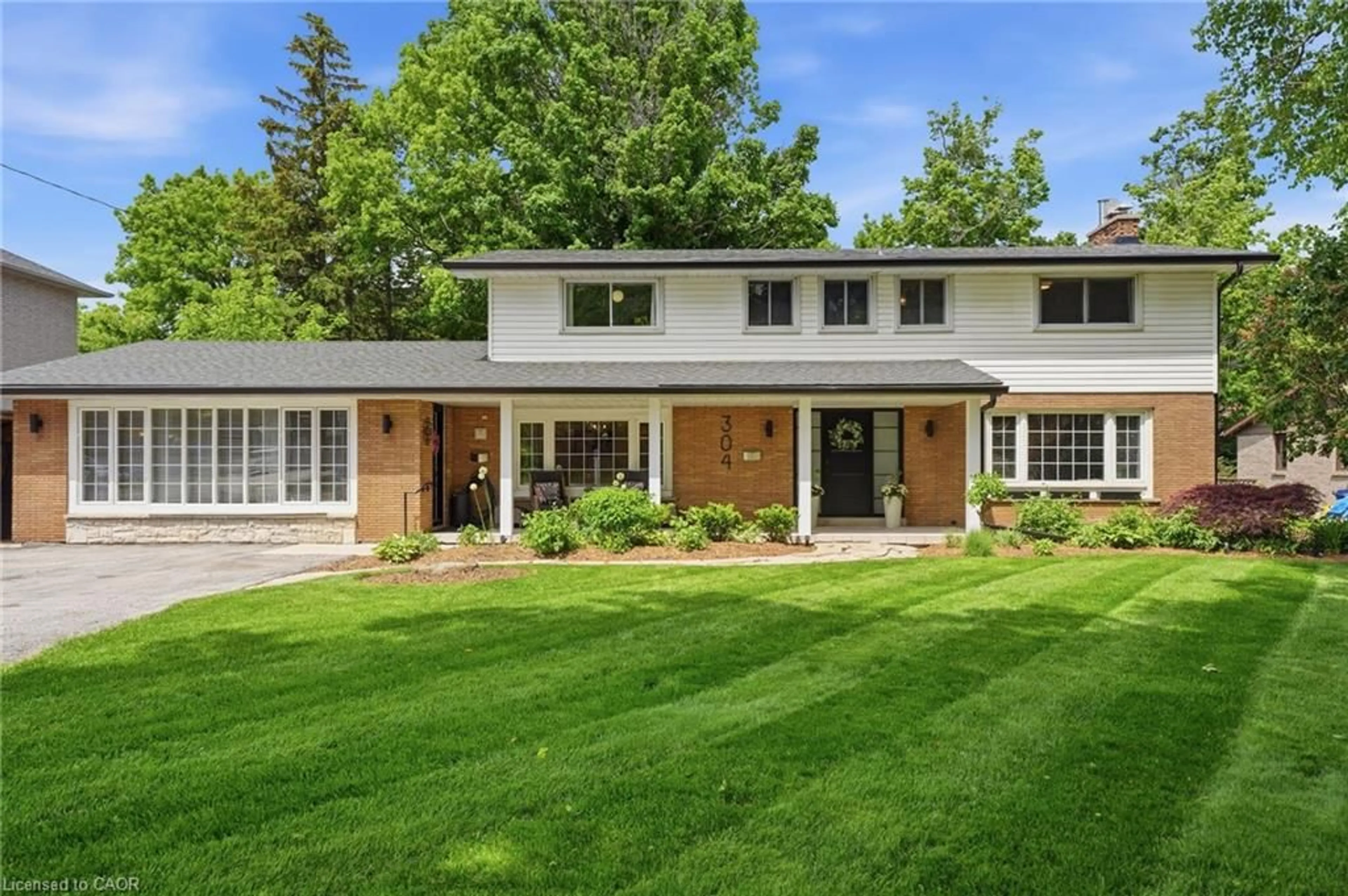 Home with brick exterior material, street for 304 Stone Church Rd, Hamilton Ontario L9B 1A4