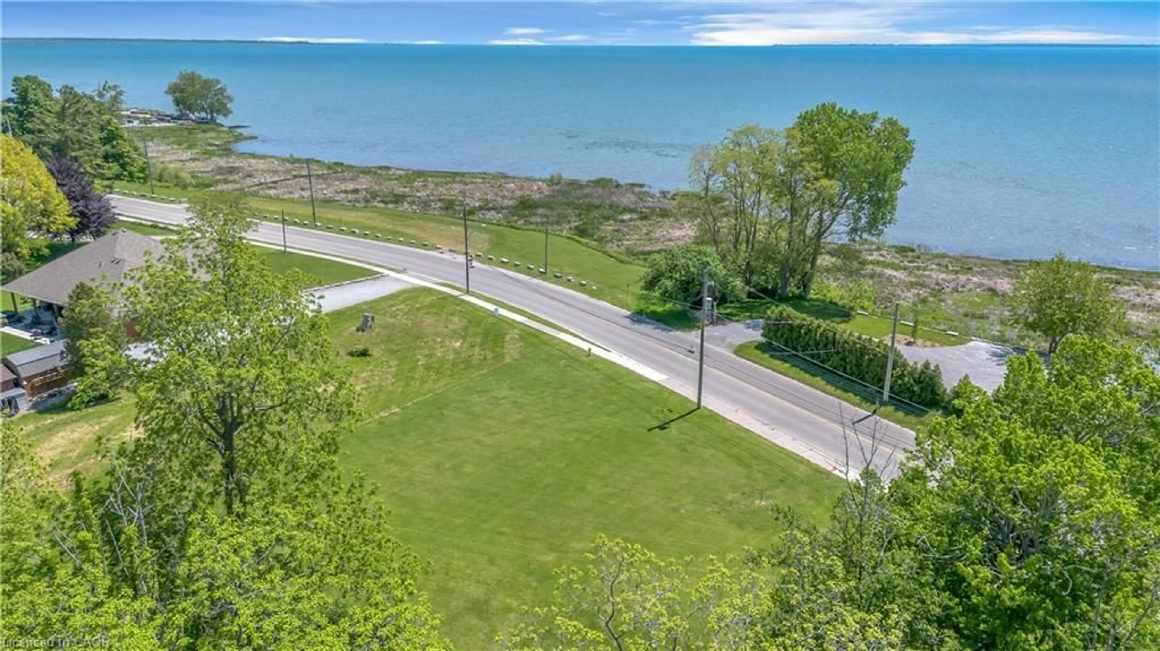 A pic from outside/outdoor area/front of a property/back of a property/a pic from drone, water/lake/river/ocean view for 71 Wolven St, Port Rowan Ontario N0E 1M0