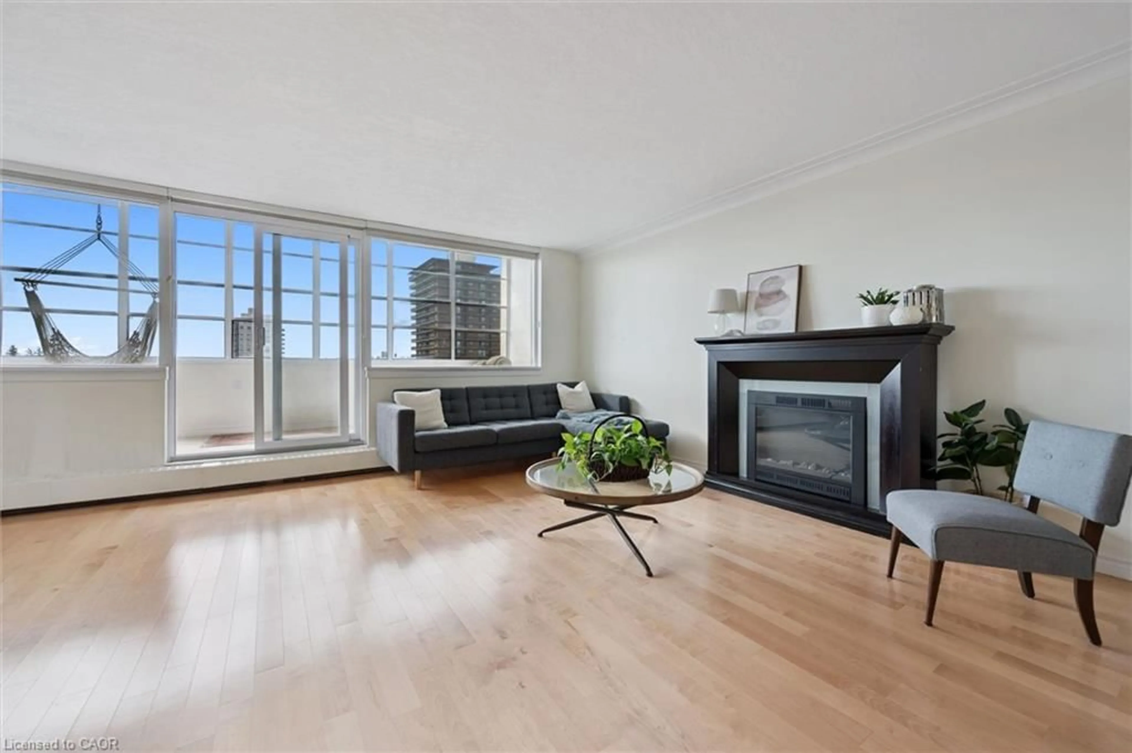 Living room with furniture, wood/laminate floor for 65 Westmount Rd #910, Waterloo Ontario N2L 5G6