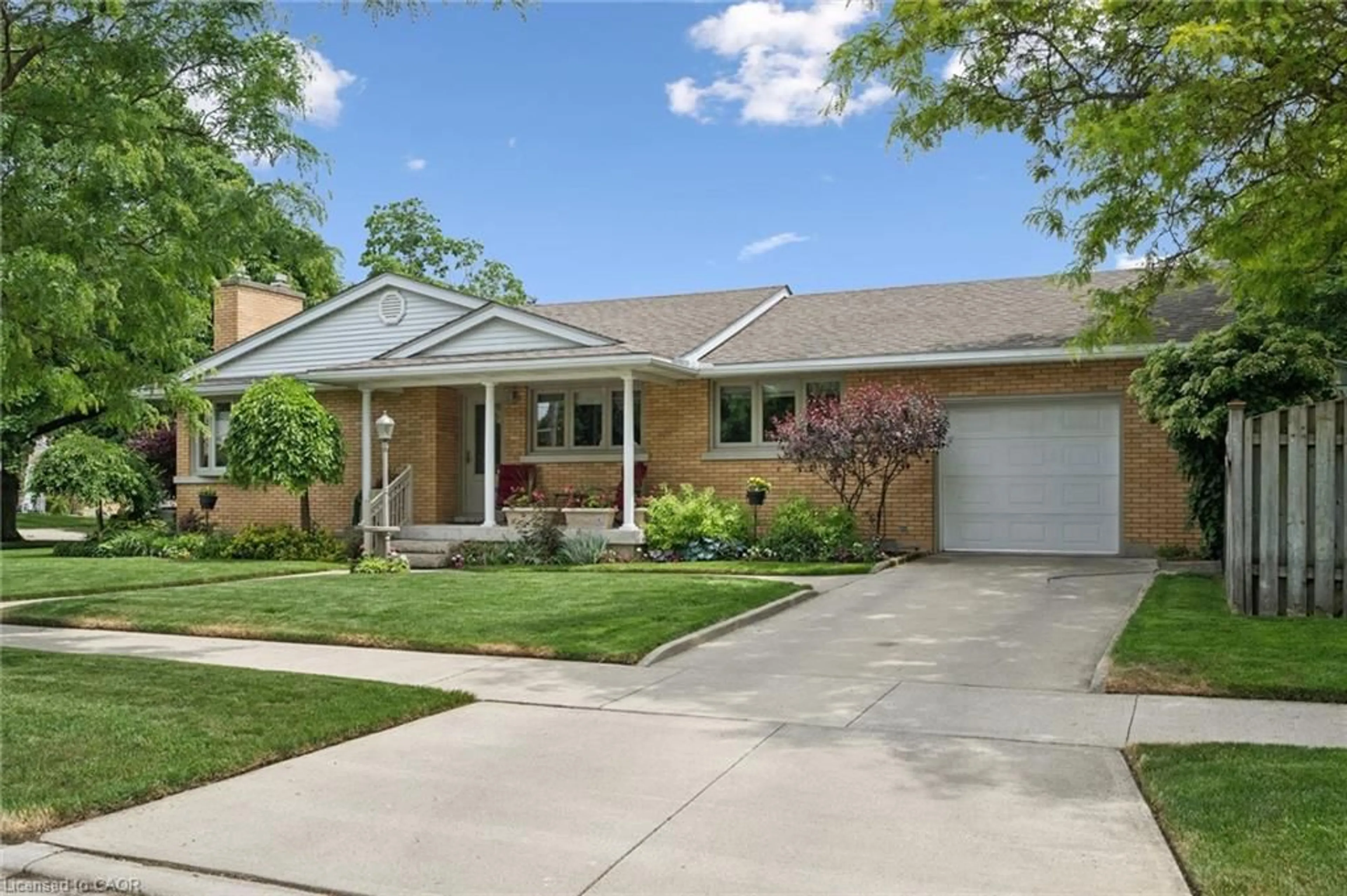 Home with brick exterior material, street for 317 Pandora Ave, Kitchener Ontario N2H 3E4