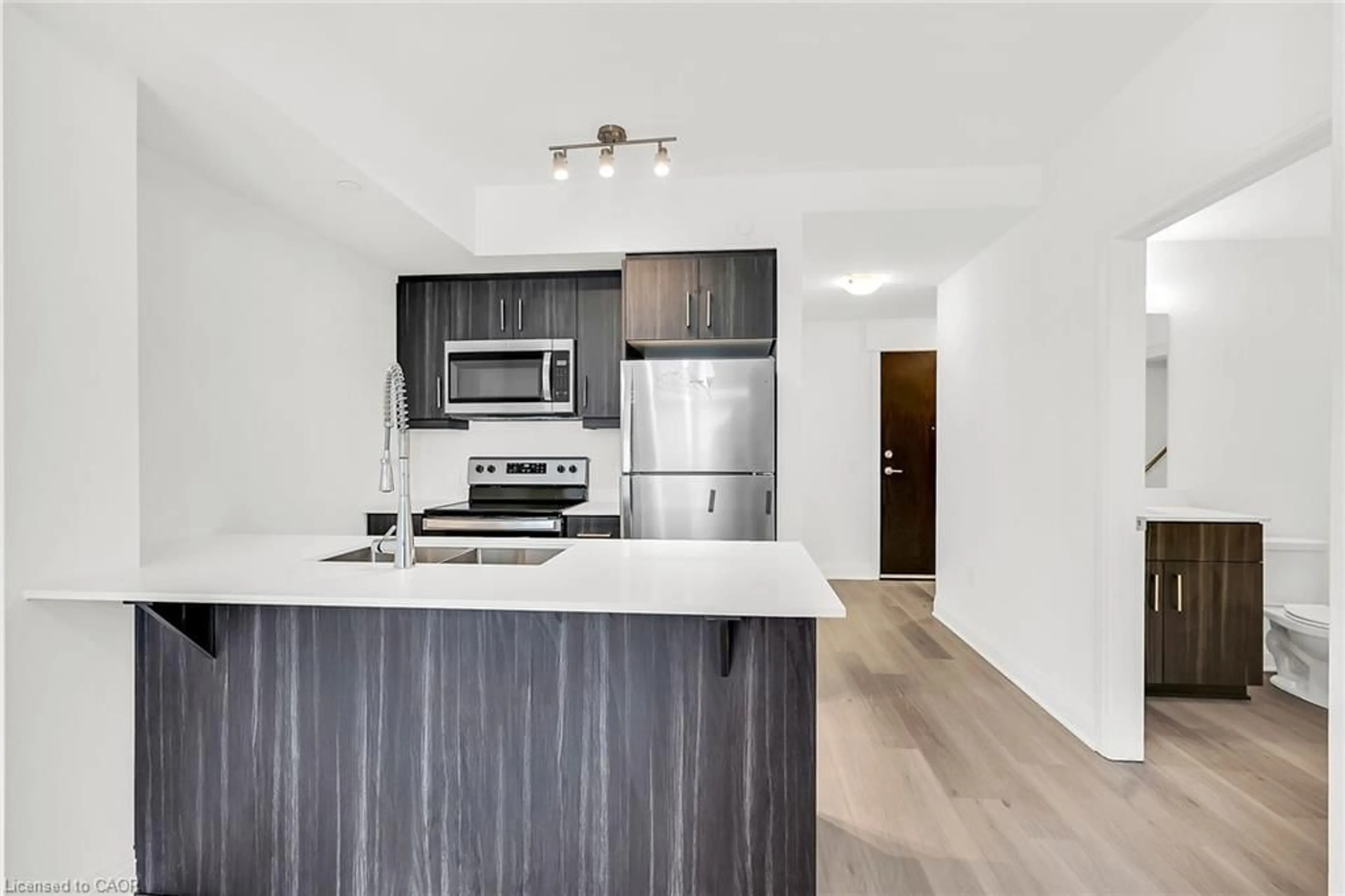 Open concept kitchen, wood/laminate floor for 1936 Rymal Rd #310, Hamilton Ontario L0R 1P0