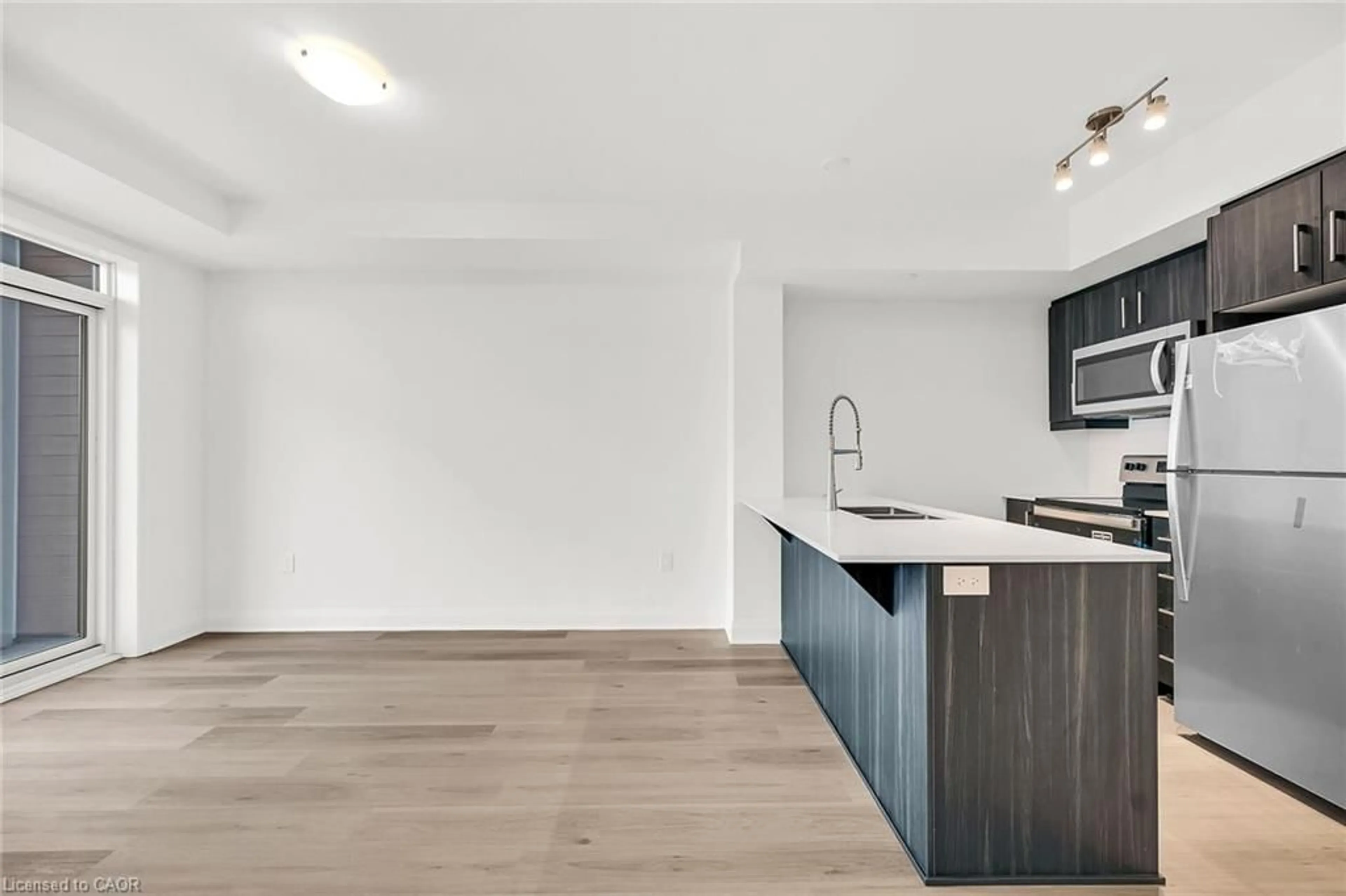Open concept kitchen, wood/laminate floor for 1936 Rymal Rd #310, Hamilton Ontario L0R 1P0