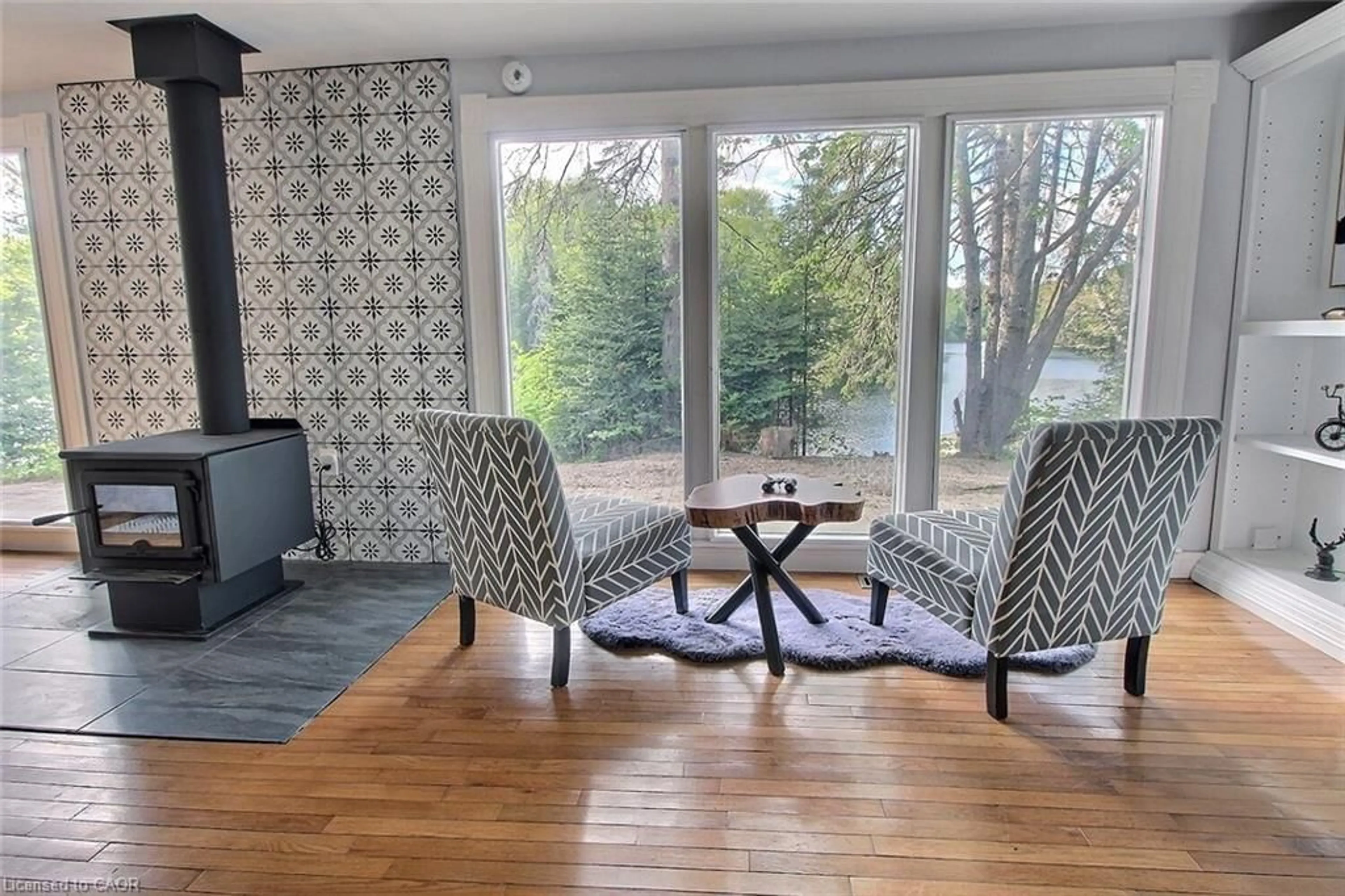 Living room with furniture, wood/laminate floor for 325 Balsam Chutes Rd, Port Sydney Ontario P0B 1L0