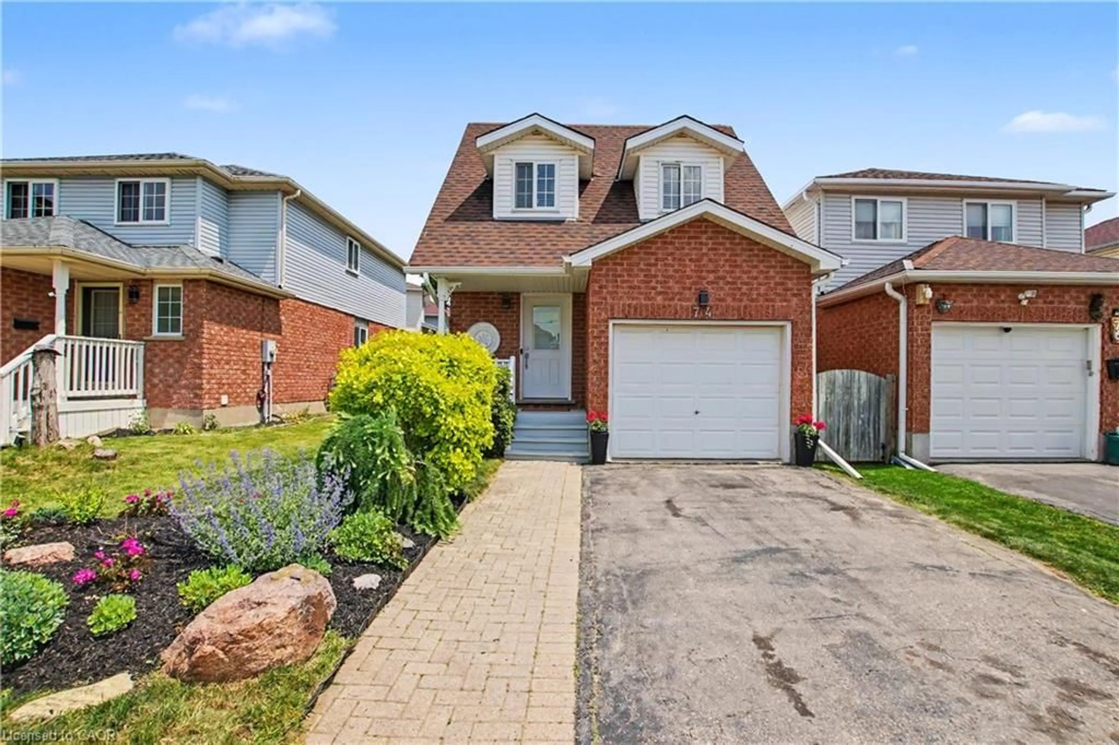 Home with brick exterior material, street for 74 Activa Ave, Kitchener Ontario N2E 3R4