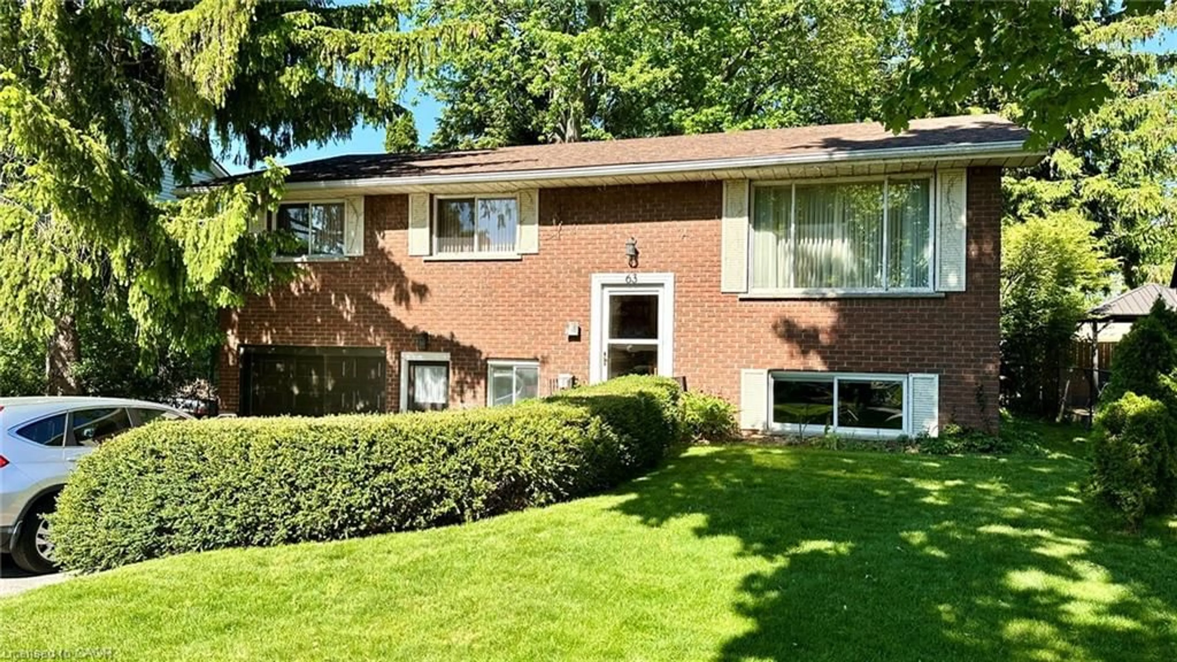Home with brick exterior material, street for 63 Lee Ave, Simcoe Ontario N3Y 5B7