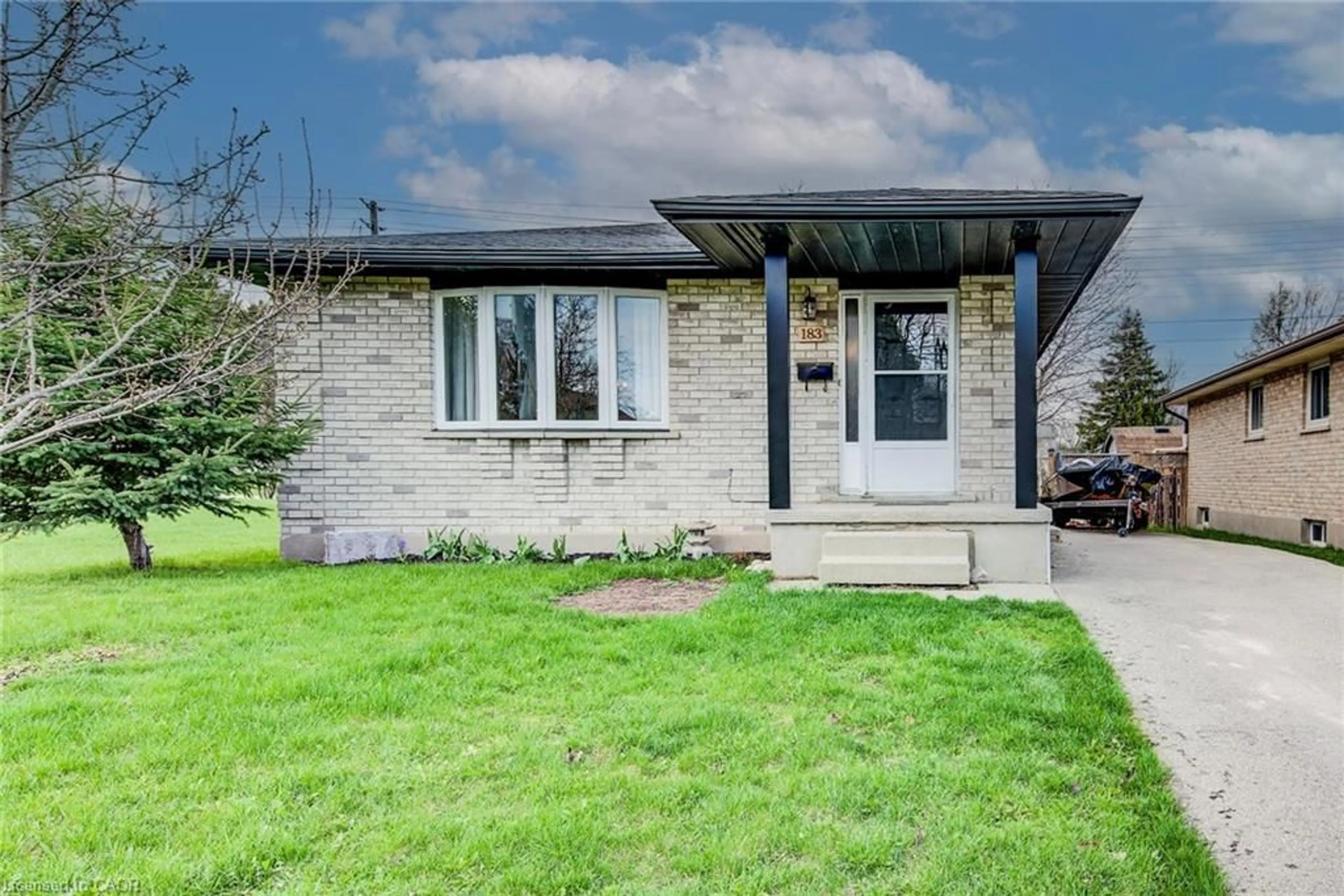 Home with brick exterior material, street for 183 Dinison Cres, Kitchener Ontario N2E 2S6