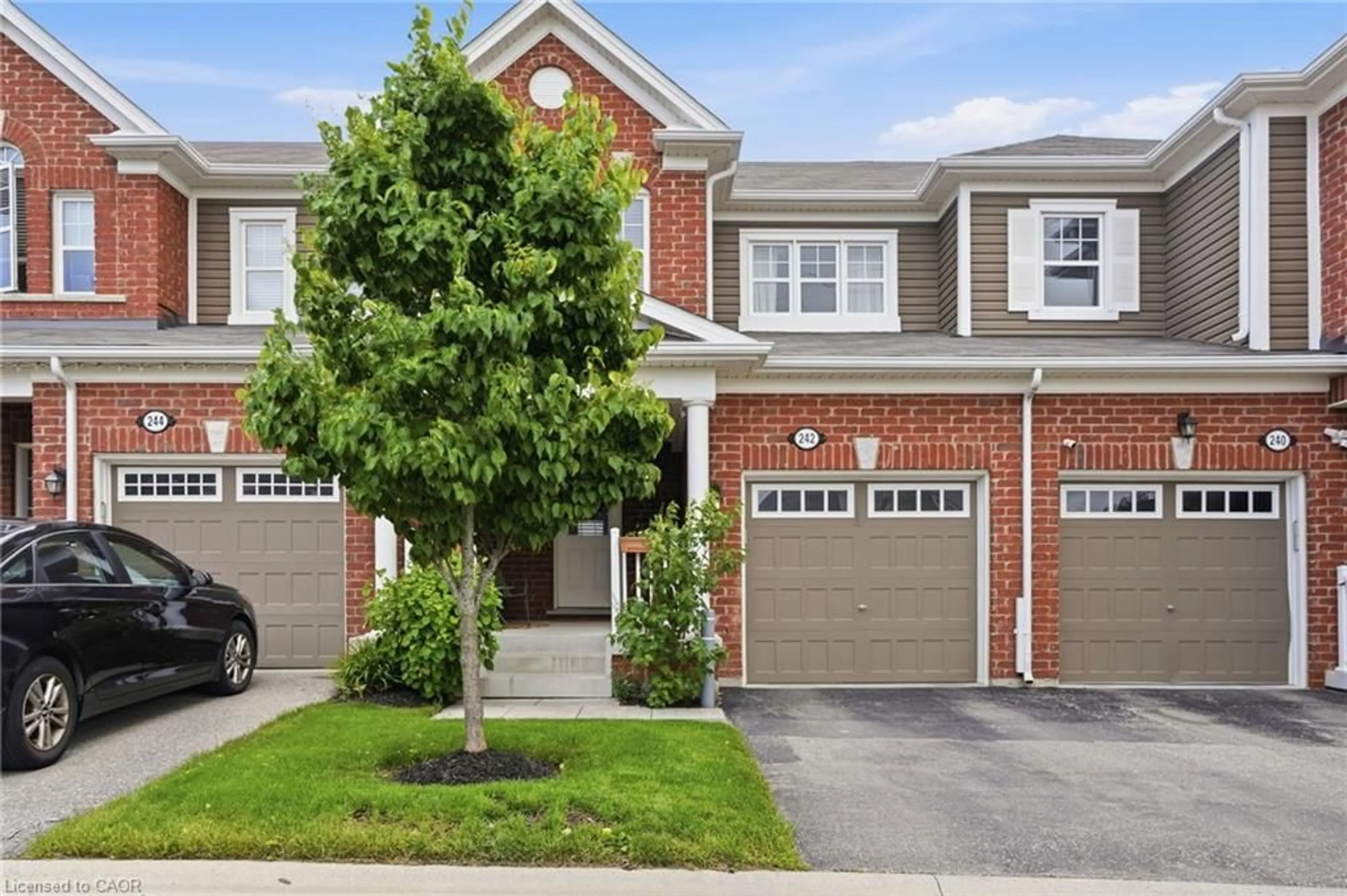 Home with brick exterior material, street for 242 Waterbrook Lane, Kitchener Ontario N2P 0H7