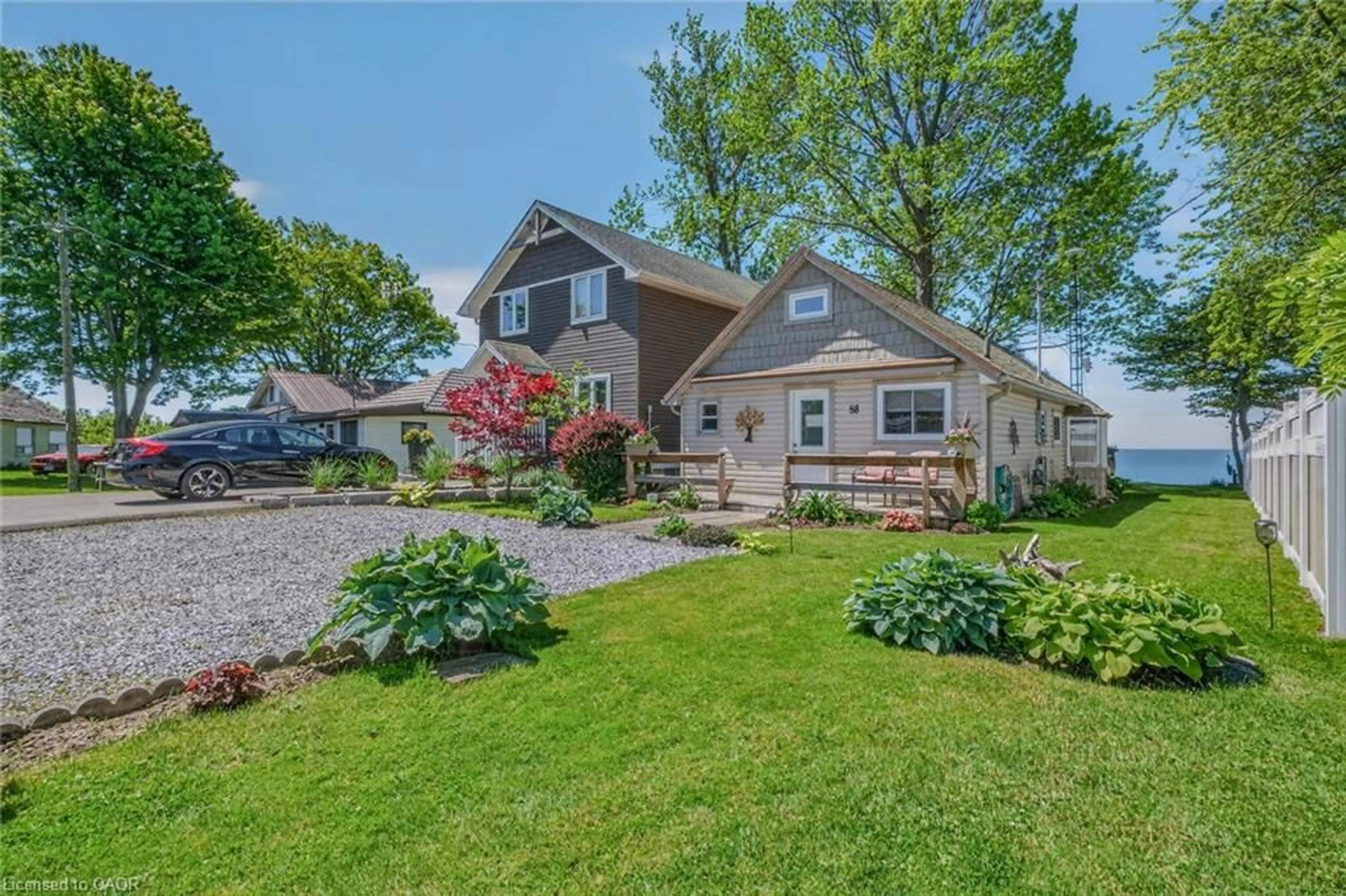 A pic from outside/outdoor area/front of a property/back of a property/a pic from drone, water/lake/river/ocean view for 58 Lakeside Dr, Nanticoke Ontario N0A 1L0