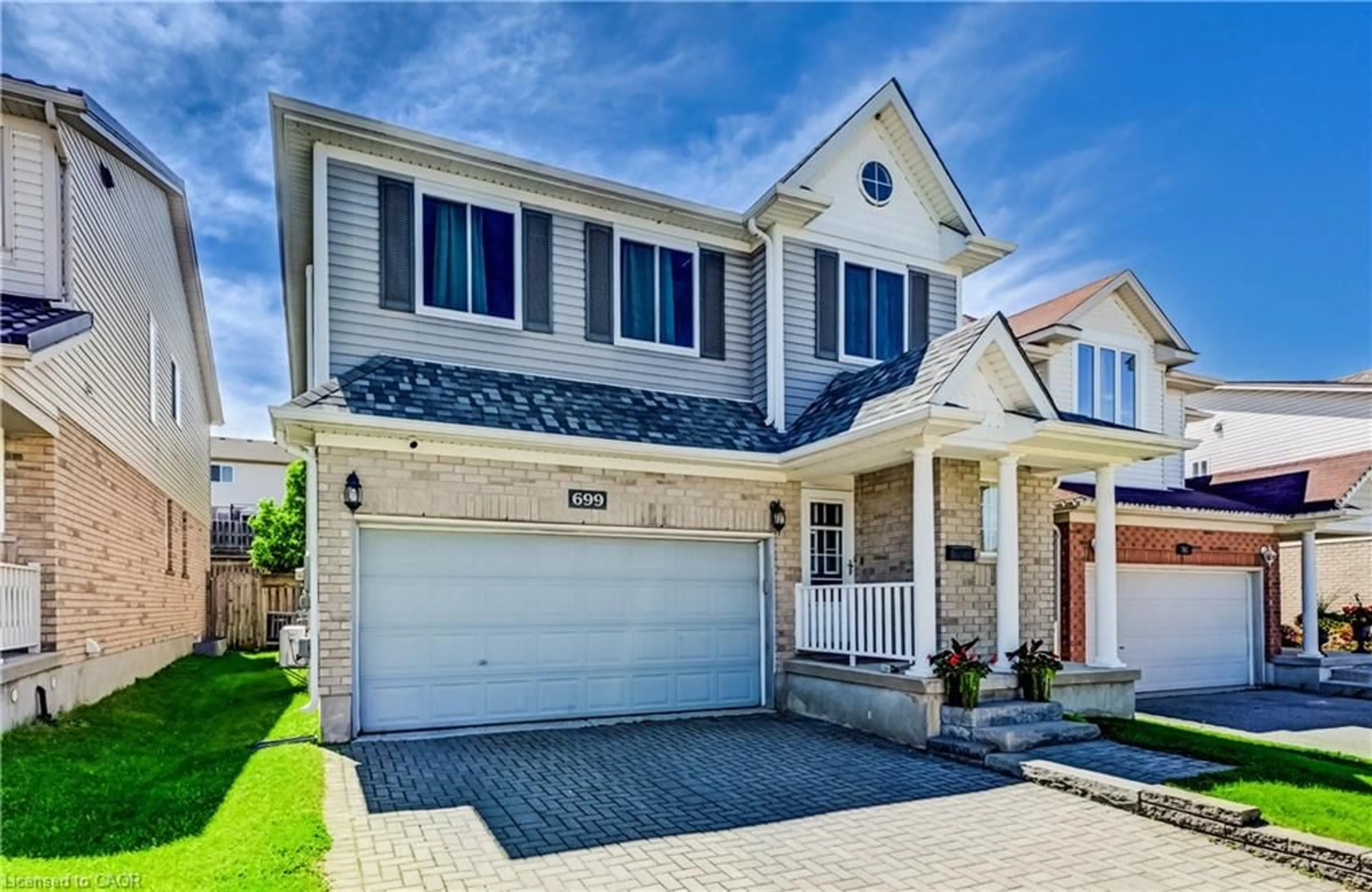 Home with vinyl exterior material, street for 699 Commonwealth Cres, Kitchener Ontario N2E 4J8