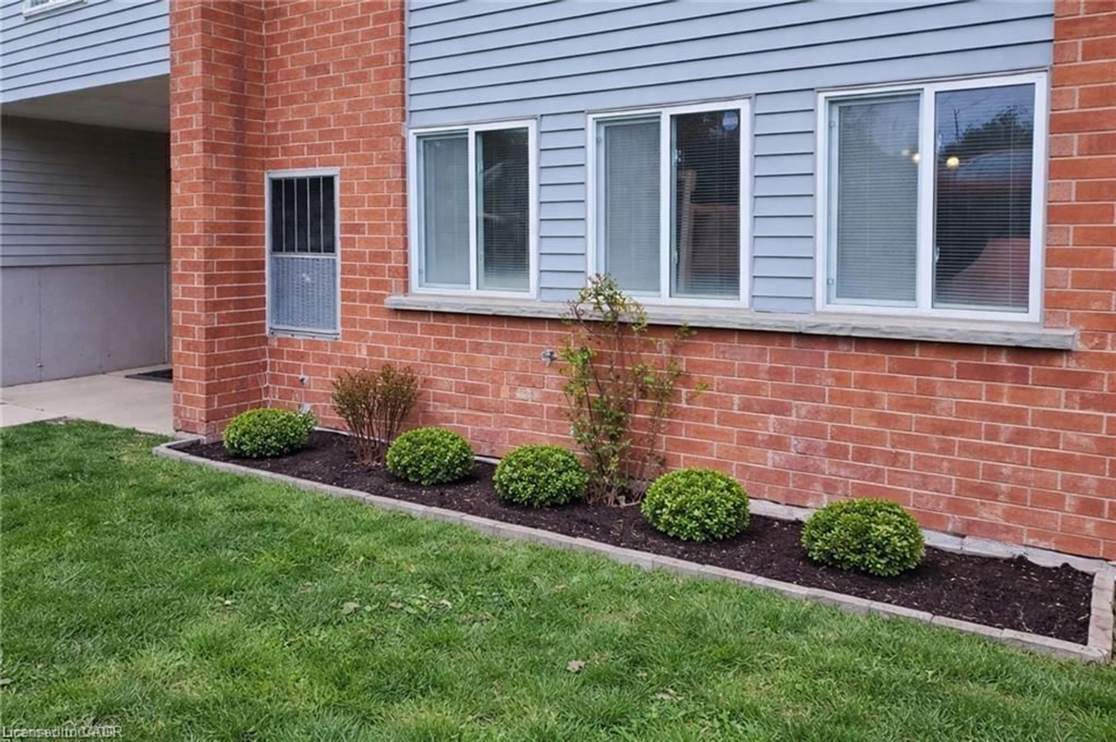Home with brick exterior material, street for 500 Westmount Rd #103, Kitchener Ontario N2M 5M9