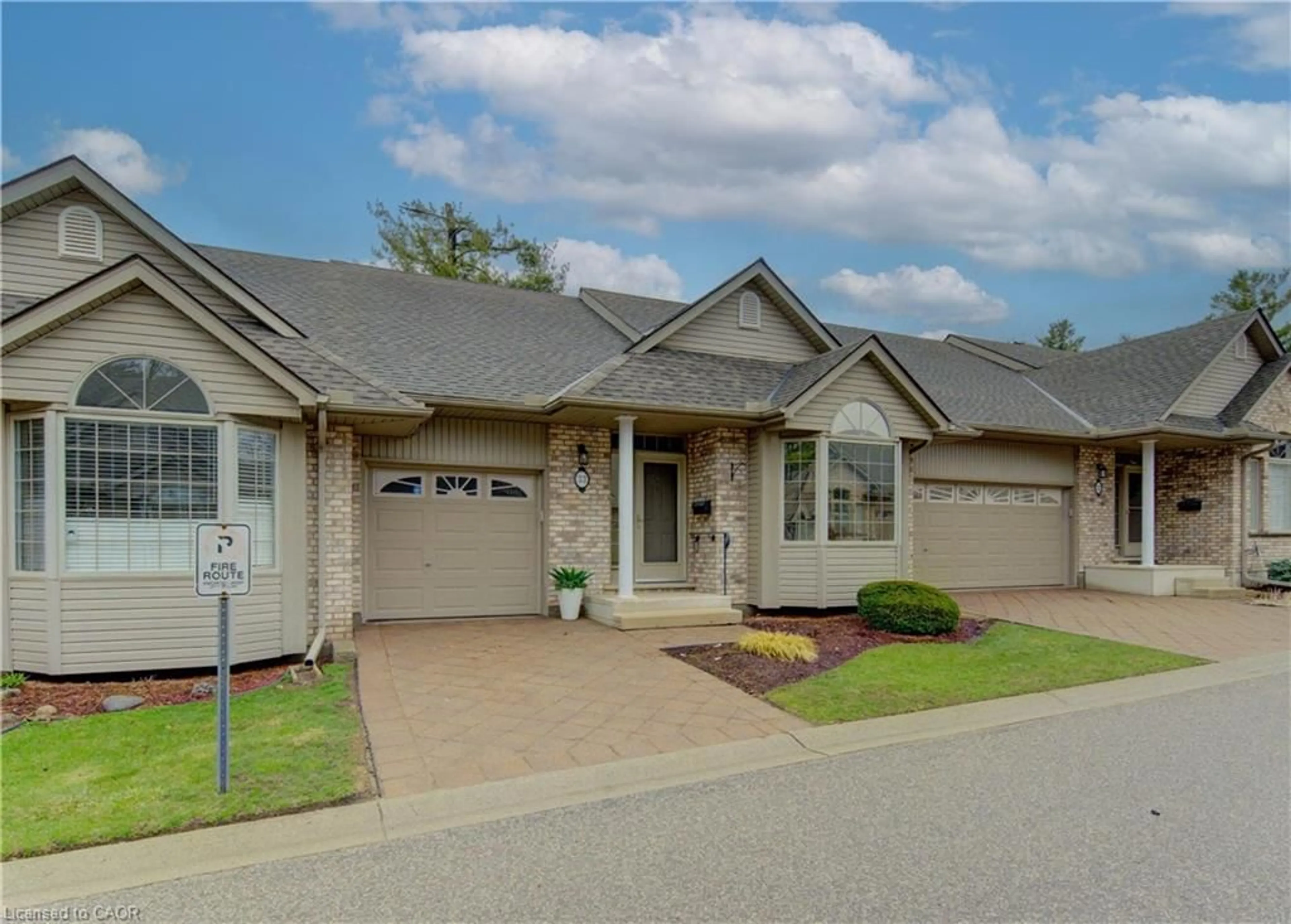 Home with brick exterior material, street for 74 Autumn Ridge Trail #33, Kitchener Ontario N2P 2M5
