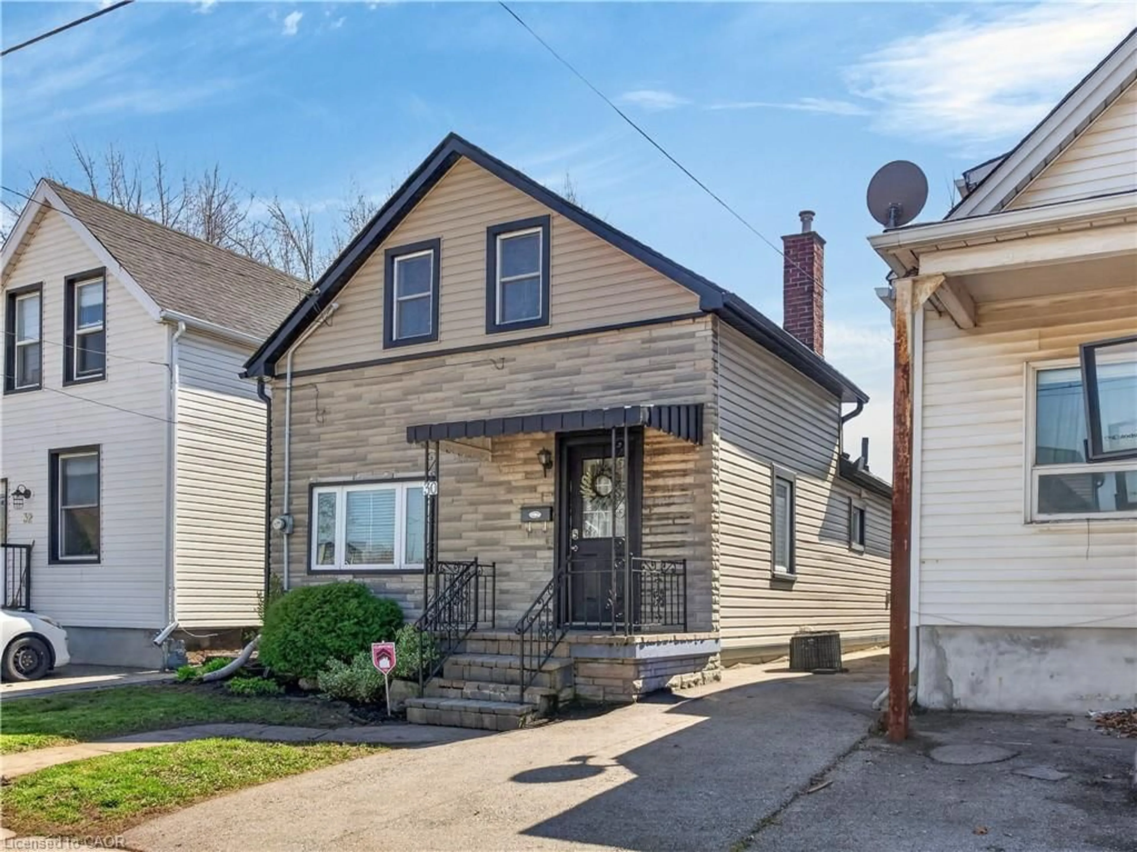 Home with vinyl exterior material, street for 30 Cambridge Ave, Hamilton Ontario L8H 1T5