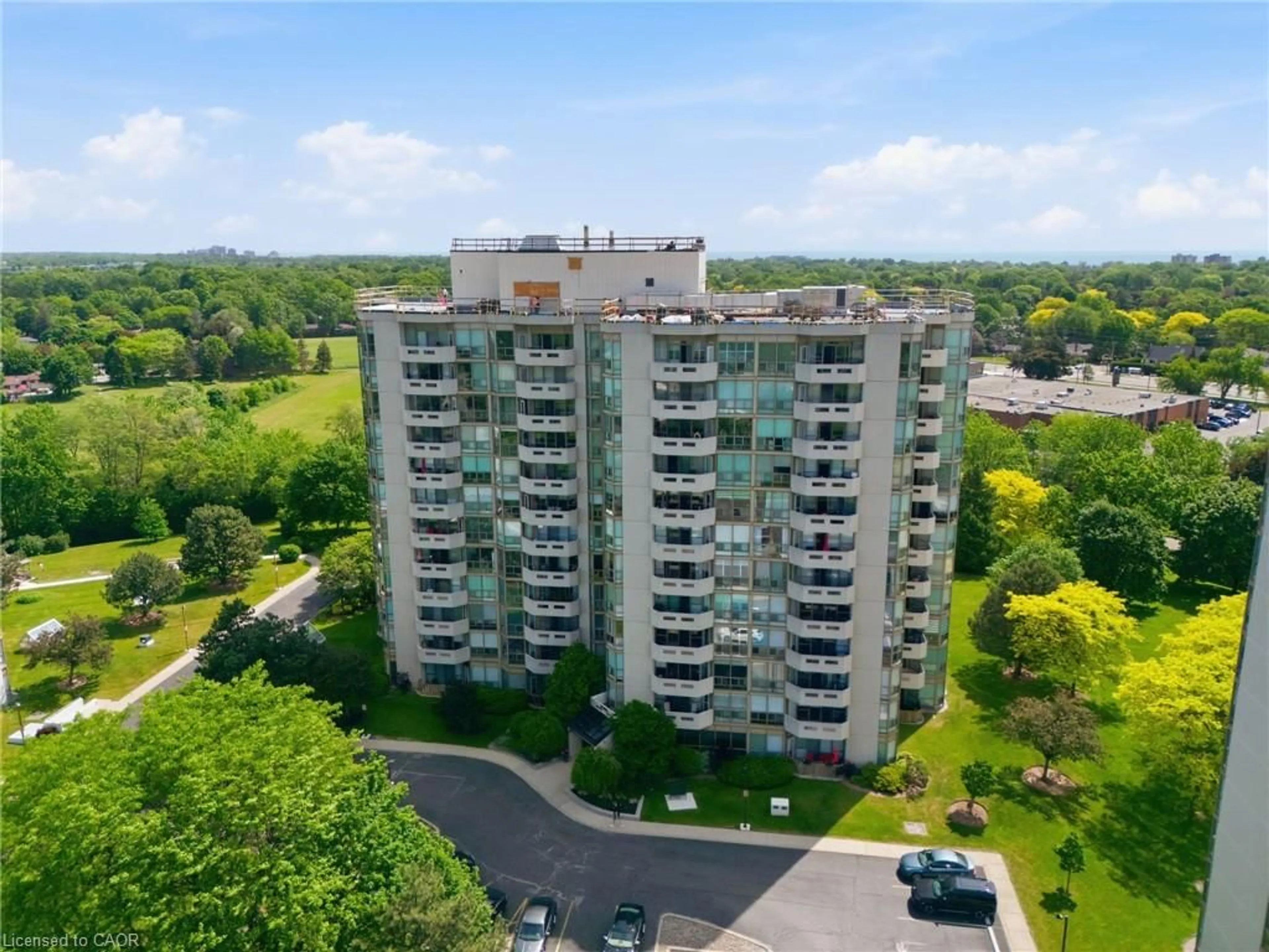 A pic from outside/outdoor area/front of a property/back of a property/a pic from drone, city buildings view from balcony for 5080 Pinedale Ave #209, Burlington Ontario L7L 5V7